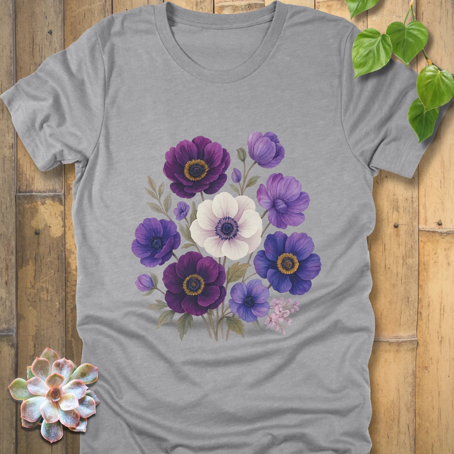 Athletic Heather t-shirt featuring a bouquet of purple, violet, blue, and white flowers with green leaves printed on the front