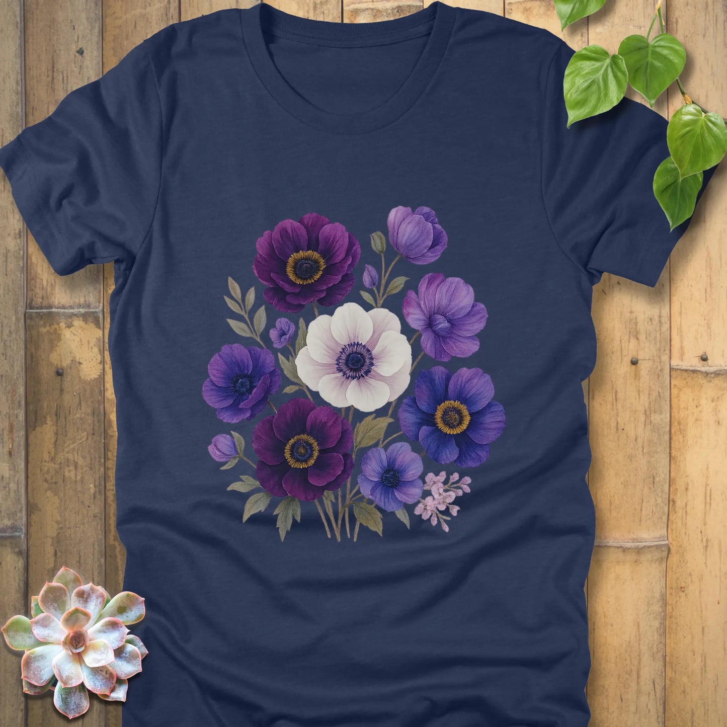 Heather Navy t-shirt featuring a floral bouquet of purple, blue, and white flowers with green leaves in a painted style