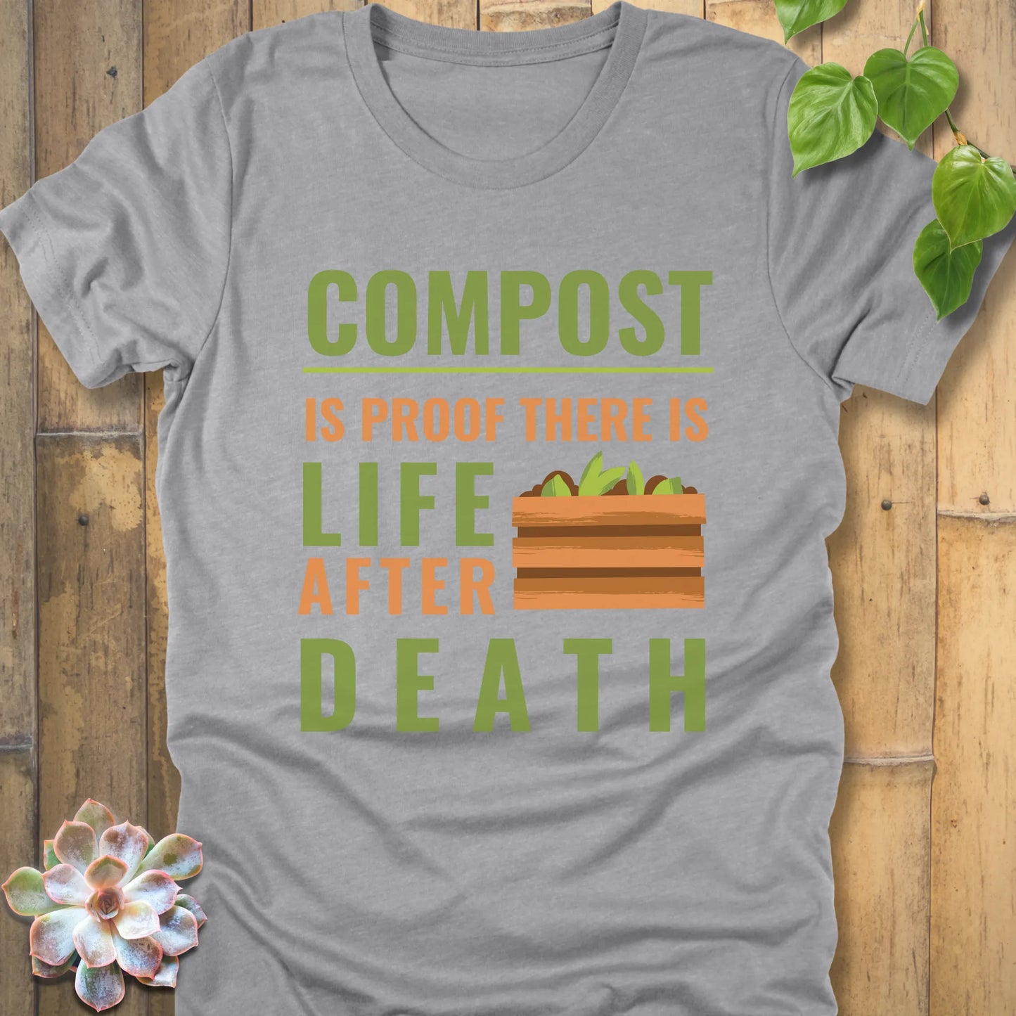Athletic Heather t-shirt featuring the design Compost is proof, there is life after death printed in bold letters