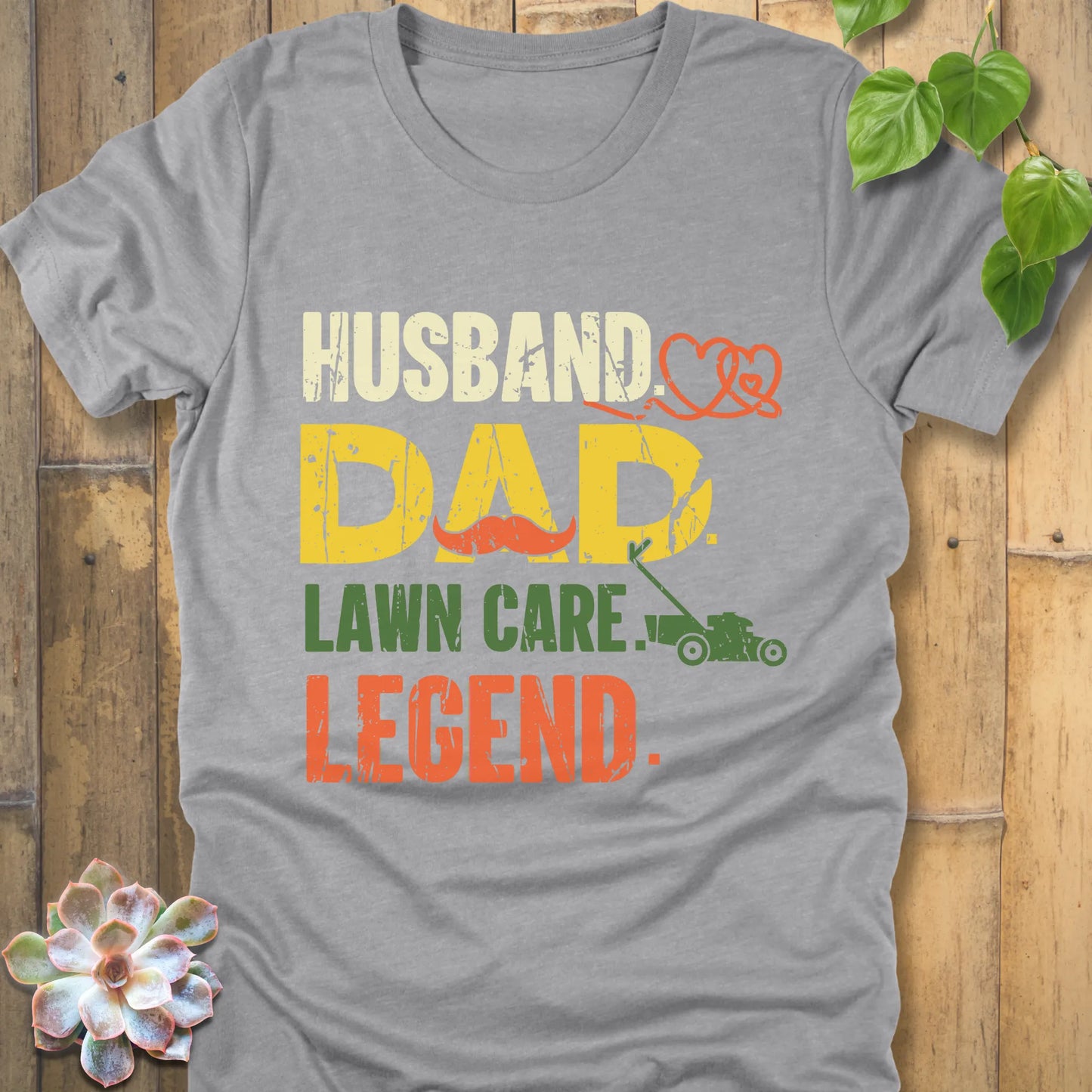 Athletic Heather t-shirt featuring the design "Husband, Dad lawn care legend" printed in bold letters
