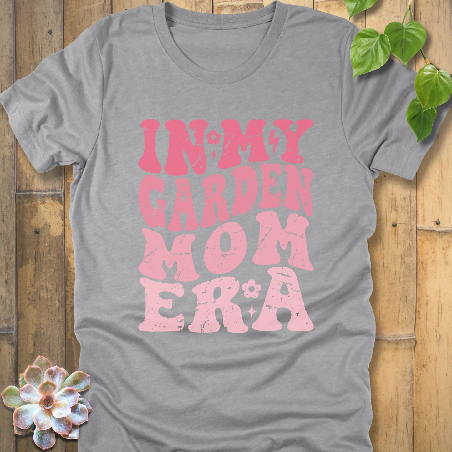 Athletic Heather t-shirt featuring the design In My Garden Mom Era printed in bold pink letters, chic outdoor gardening wear.