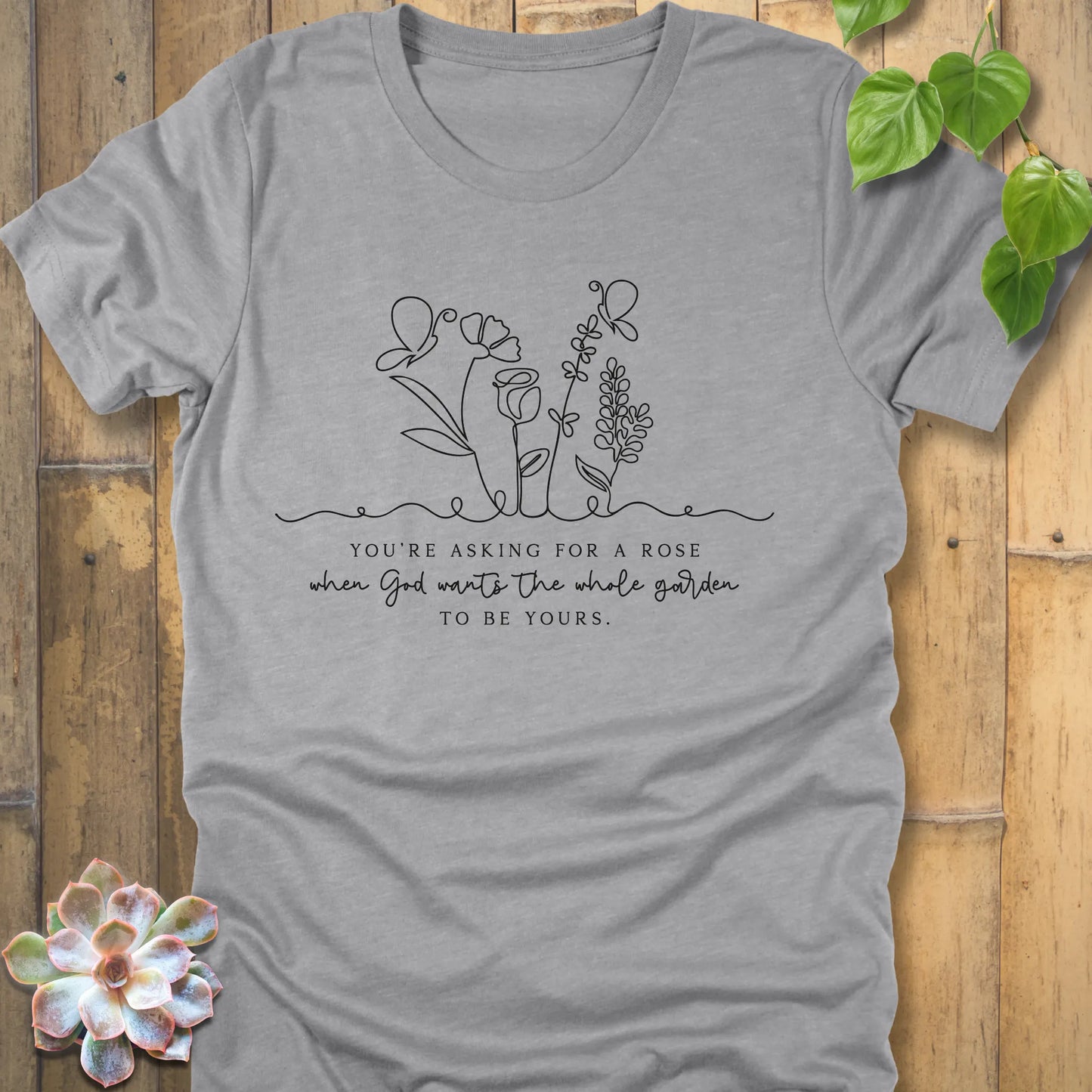 Athletic grey t-shirt featuring the design Asking for a rose, printed in blakc letters everyday comfort tee