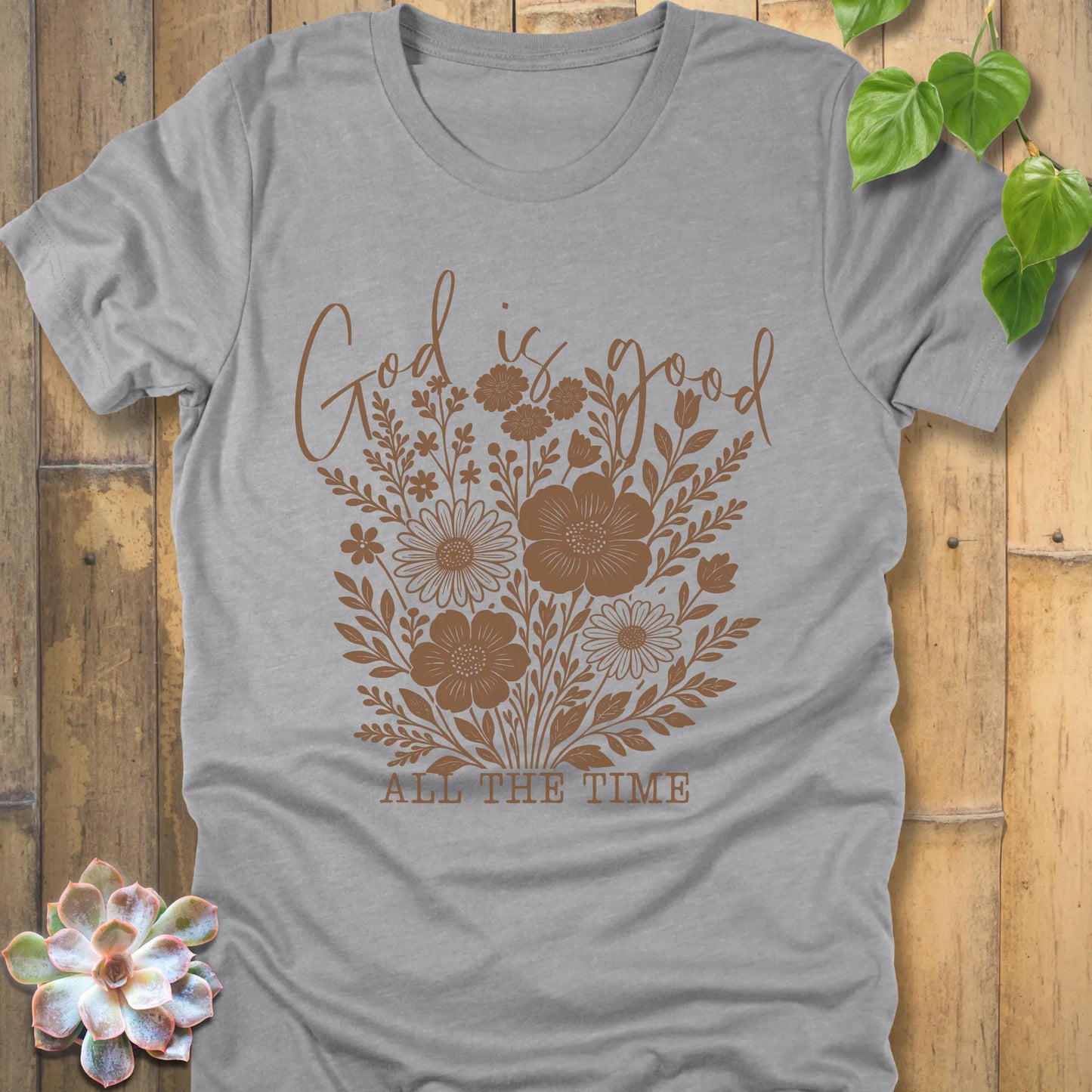 Athletic grey t-shirt featuring the design God is Good printed with flowers in a soft floral style