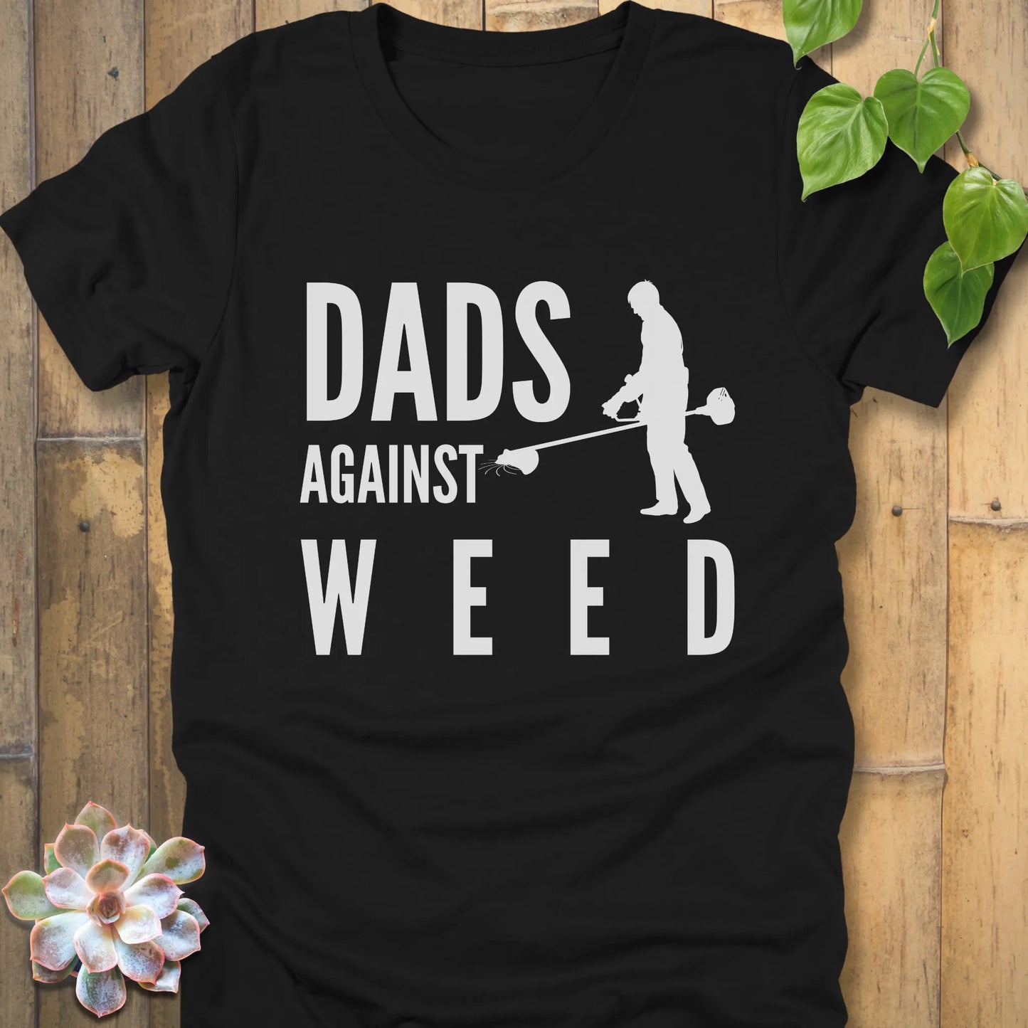 Black t-shirt featuring the design Dads Against Weed printed with man mowing.