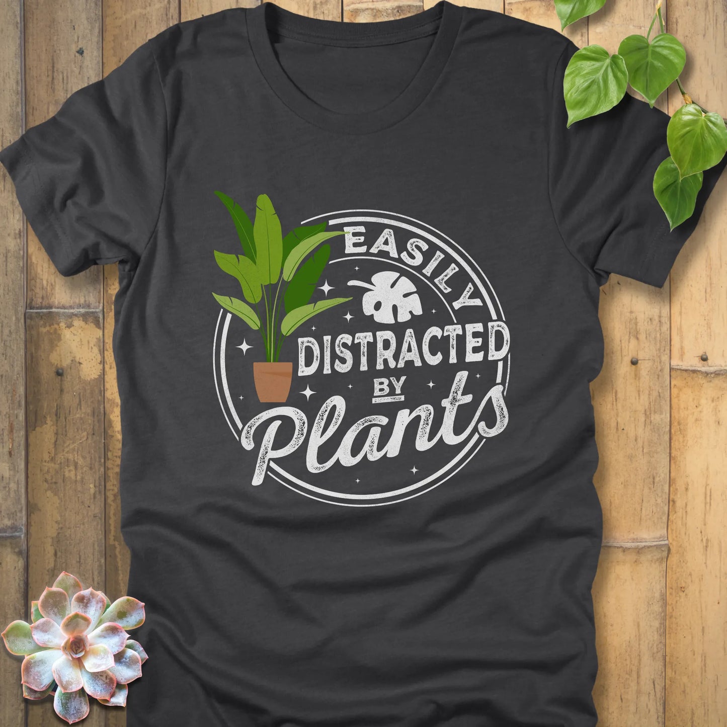 Dark Grey Heather t-shirt featuring the design Easily Distracted by Plants with a print of a potted plant