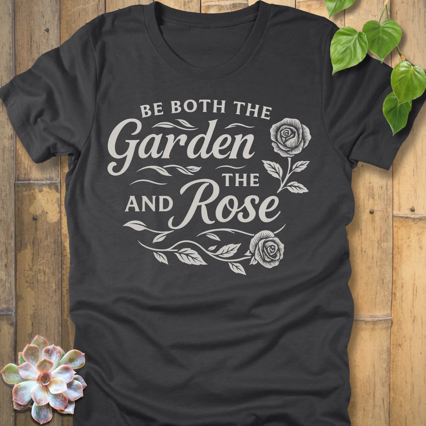 Dark Grey Heather t-shirt featuring the design Garden and the Rose printed in bold letters, floral gardening shirt.