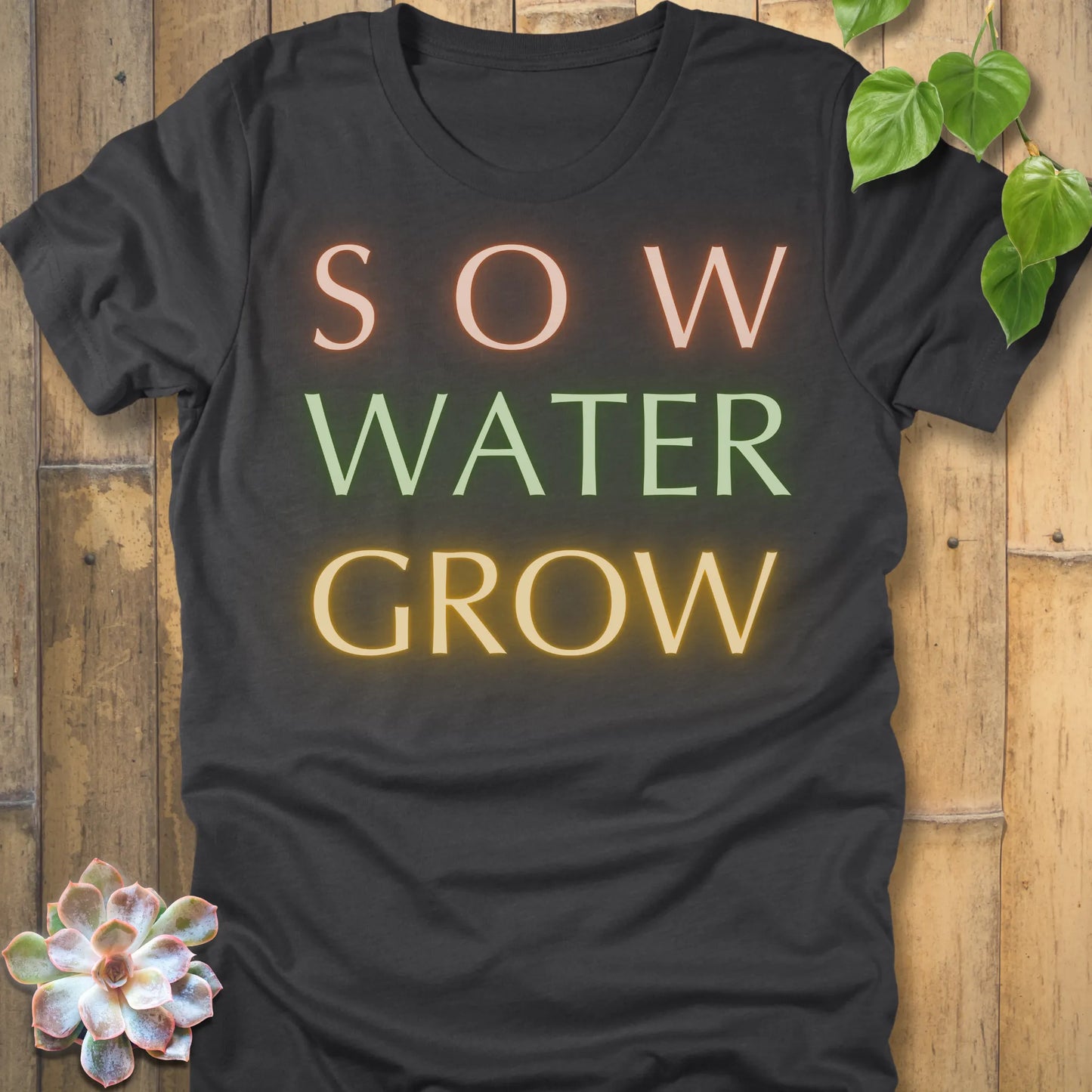Dark Grey Heather t-shirt featuring the design Grow Dammit printed in bold letters, funny gardening shirt.