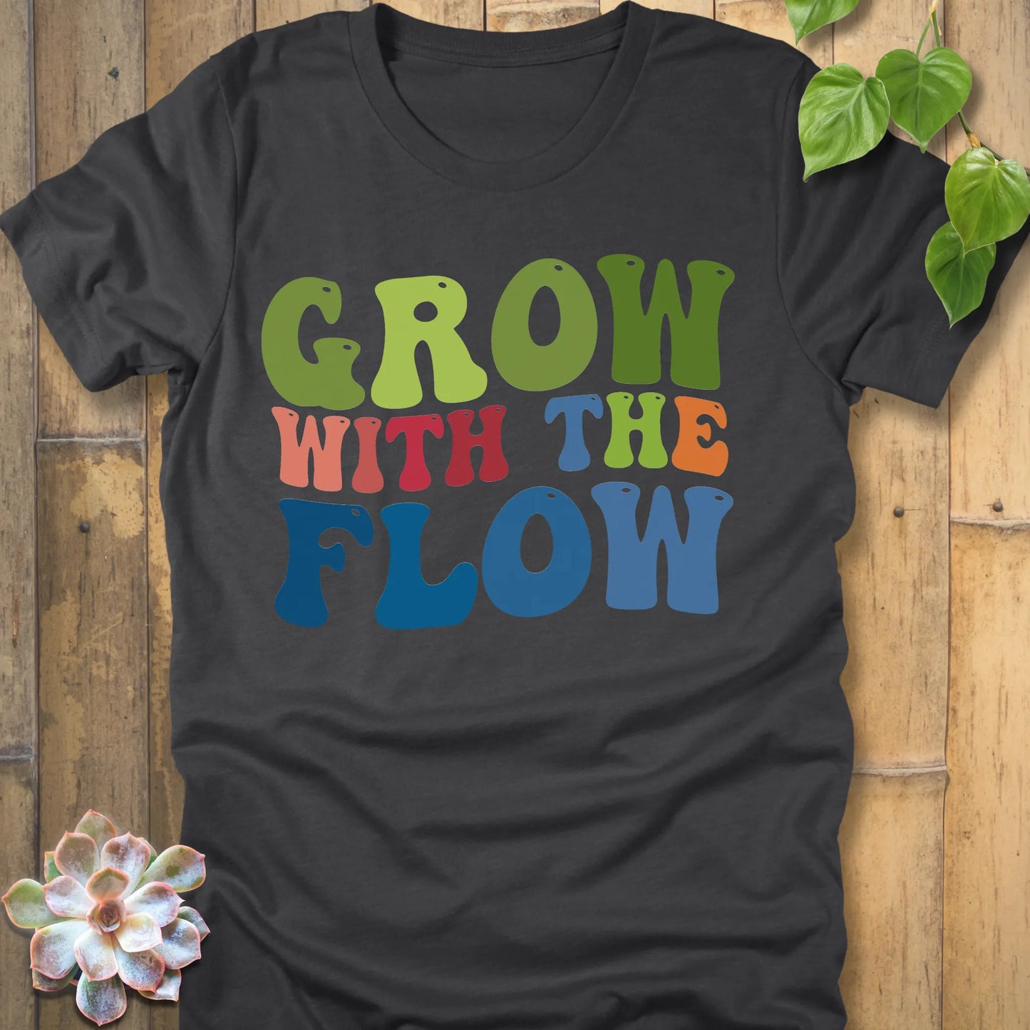Dark Grey Heather t-shirt featuring the design Grow In The Flow printed in colourful bold letters