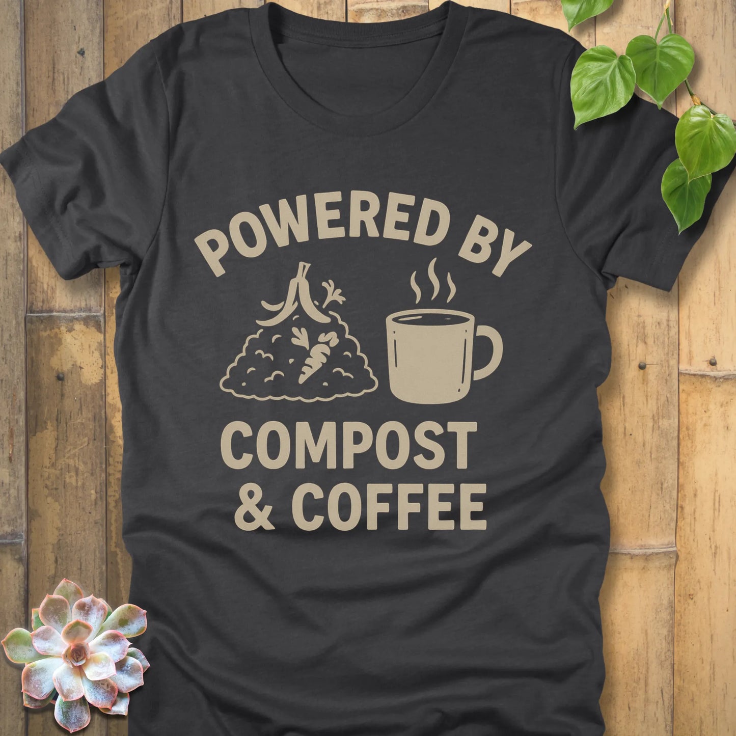 Dark Grey Heather t-shirt featuring the design Powered By Compost & Coffee printed in bold letters with mug of coffee
