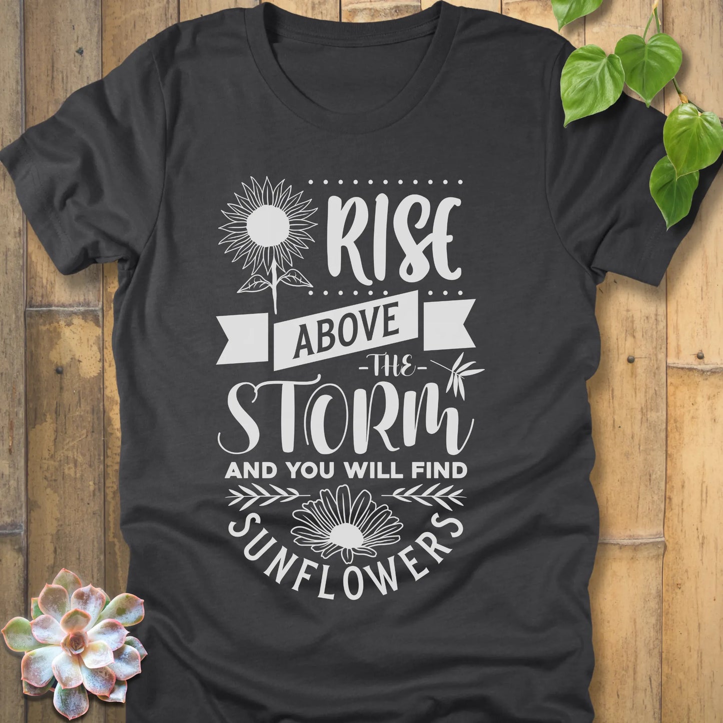 Dark Grey Heather t-shirt featuring the design Rise above the storm and you will find sunflowers printed in white letters