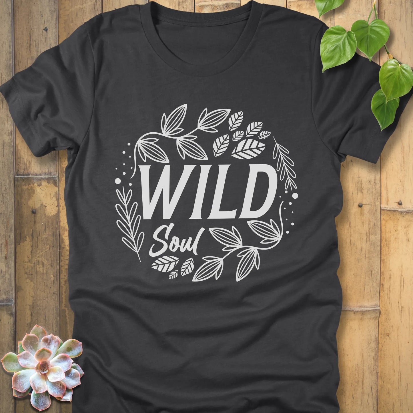 Dark Grey Heather t-shirt featuring the design Wild Soul printed in black letters with leaves