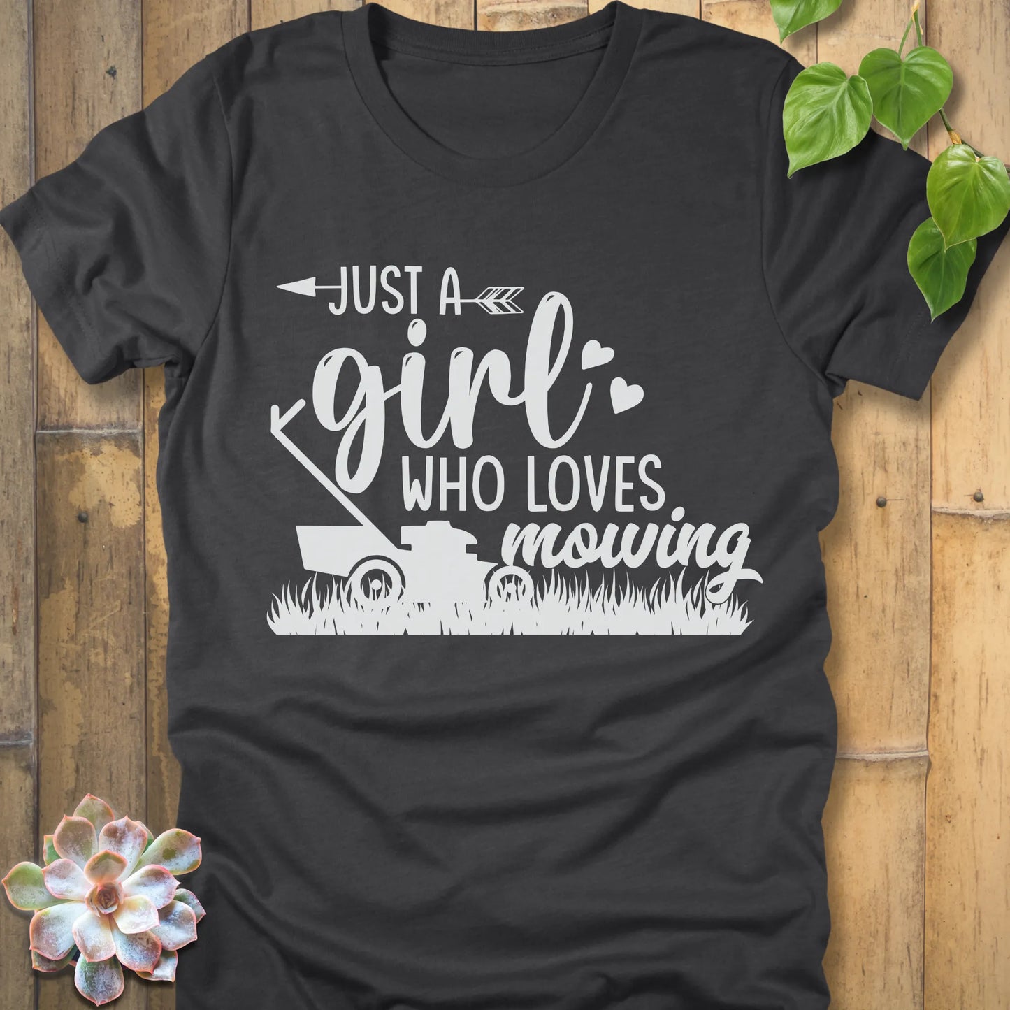 Dark Heather t-shirt featuring the design Just a girl who loves mowing printed with a lawn mower graphic.