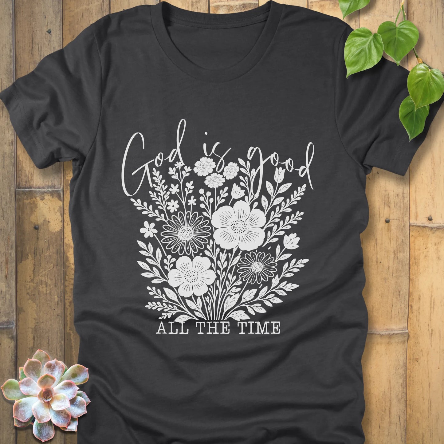 Dark grey heather t-shirt featuring the design God is Good printed with flowers in a soft floral style
