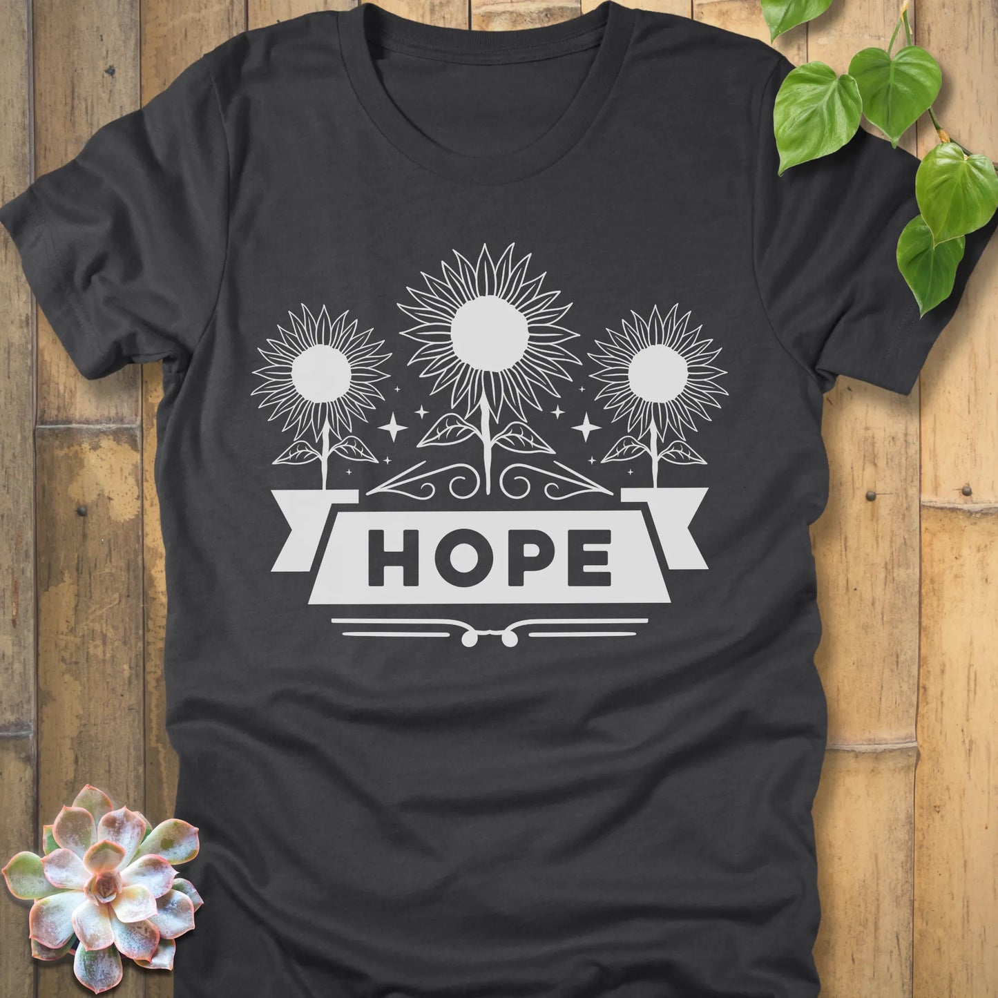 Dark grey heather t-shirt featuring the design Hope with bold letters and 3 sunflower print