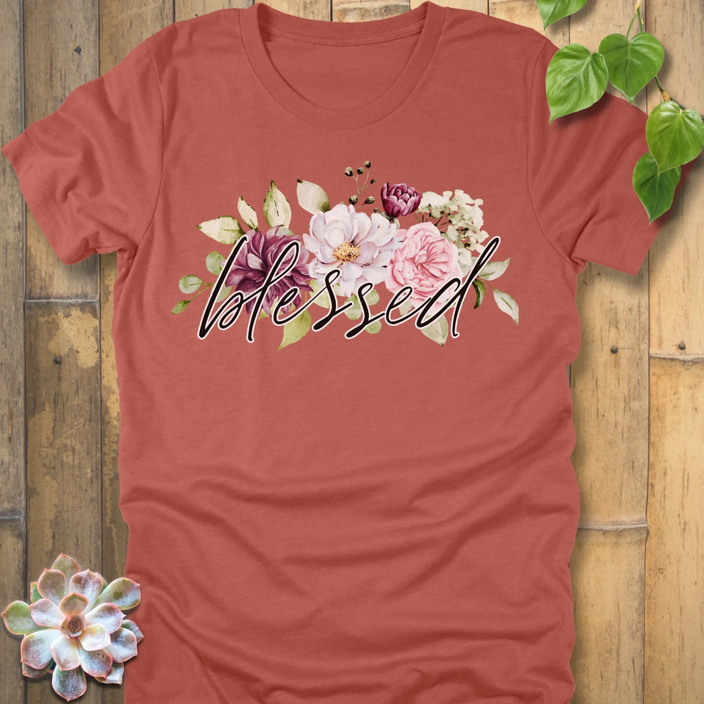 Heather Clay t-shirt featuring the design Blessed Flowers printed black letters and flowers, faith and floral shirt.