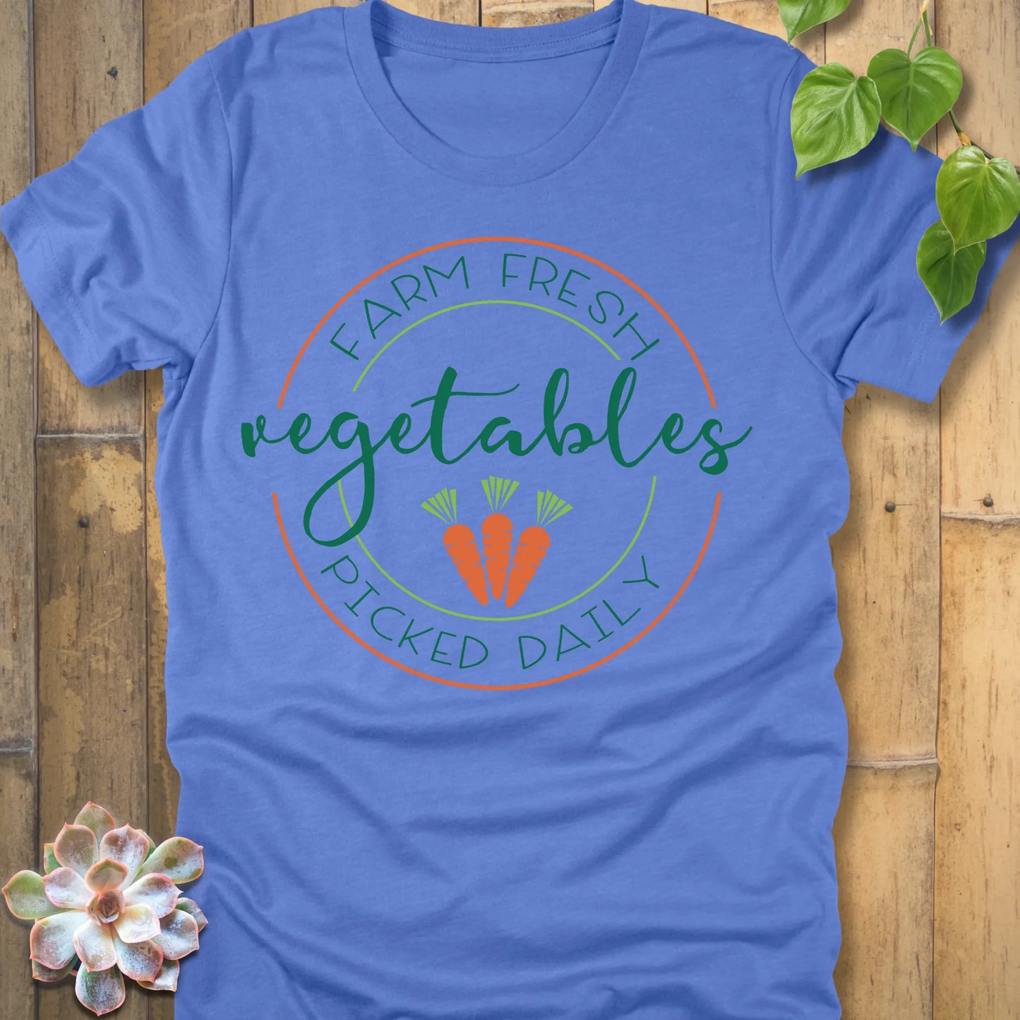 Heather Colombia Blue t-shirt featuring the design Fresh Vegetables printed in green letters and some carrots, organic vegetable lover shirt.