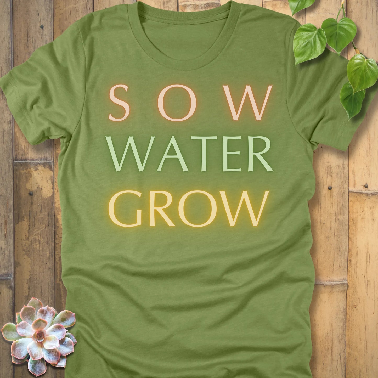 Heather Green t-shirt featuring the design Grow Dammit printed in bold letters, funny gardening shirt.