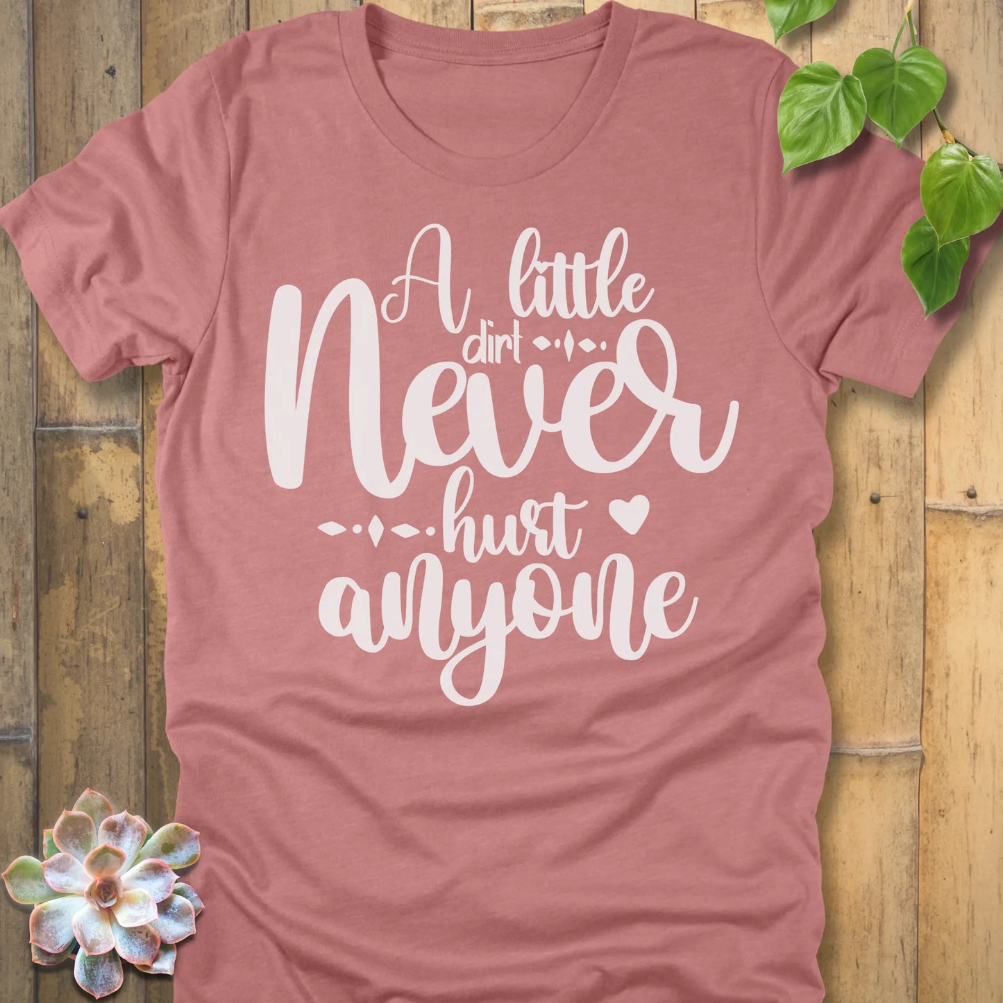 Heather Mauve gardening t-shirt featuring the design A Little Dirt printed in white letters