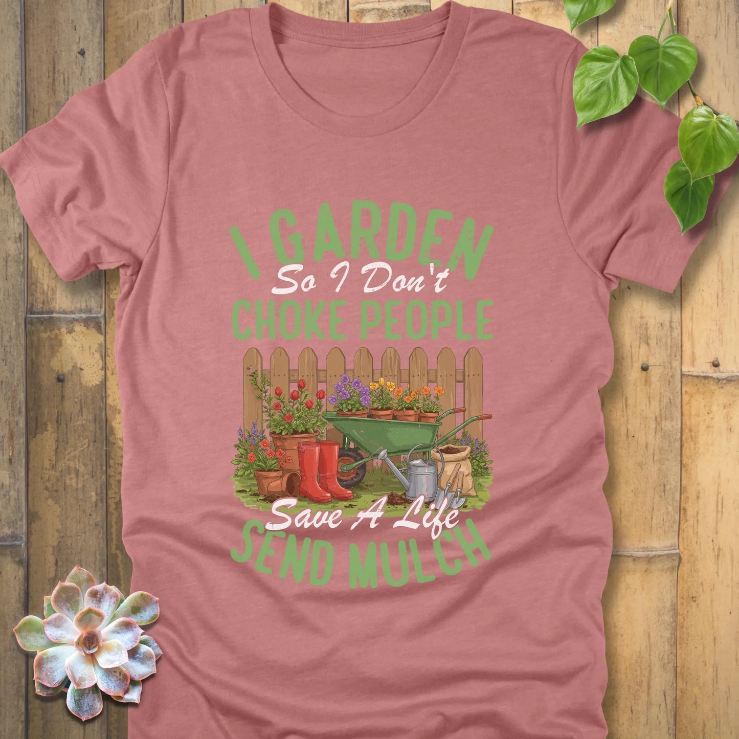 Heather Mauve t-shirt featuring the design 'I garden so I don't choke people, save a life send mulch' with plants and tools graphic