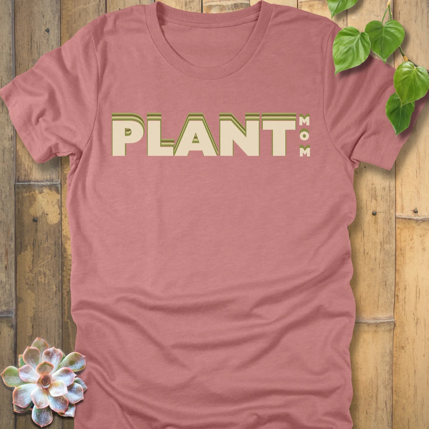 Heather Mauve t-shirt featuring the design Plant Mom printed in bold green letters