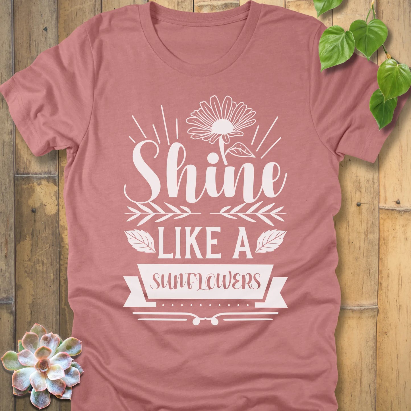 Heather Mauve t-shirt featuring the design Shine Like A Sunflower printed in bold letters with sunflower