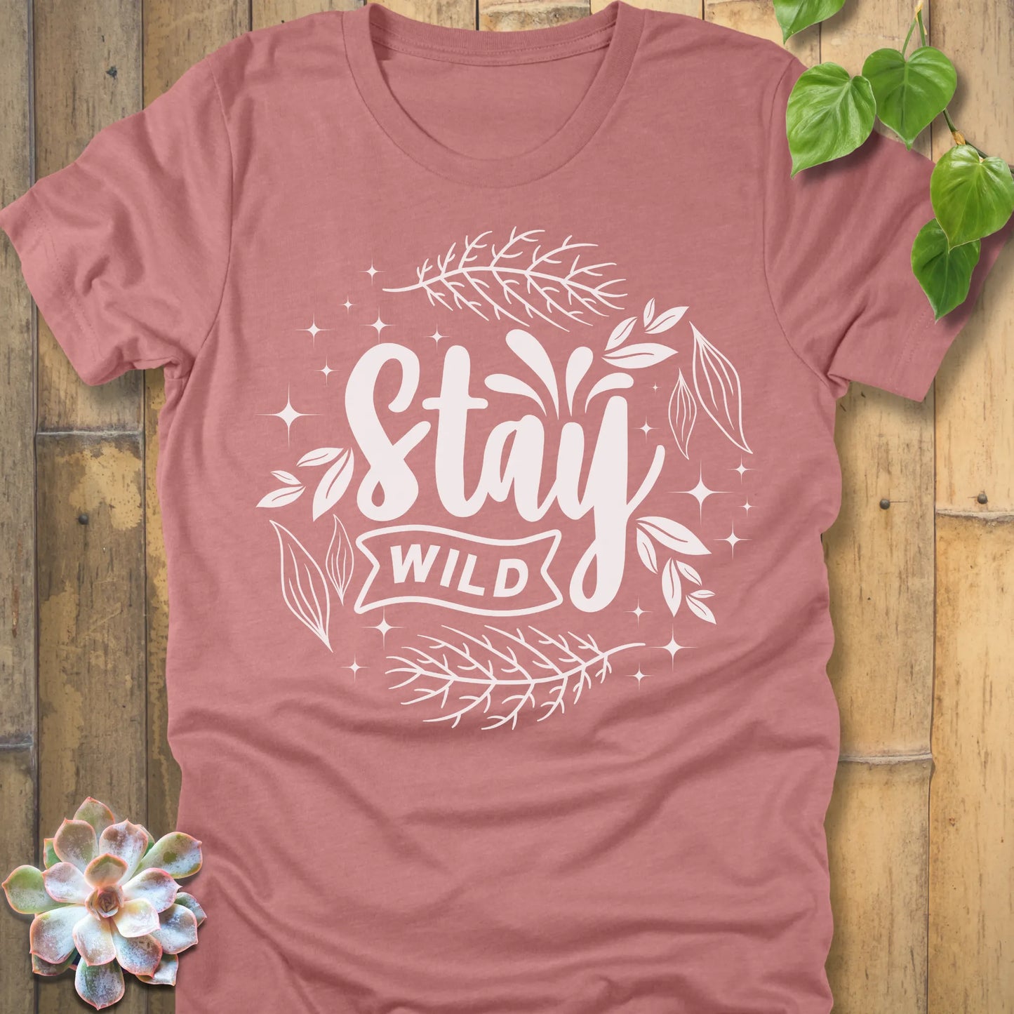 Heather Mauve t-shirt featuring the design Stay Wild printed in white letters, nature lover shirt.