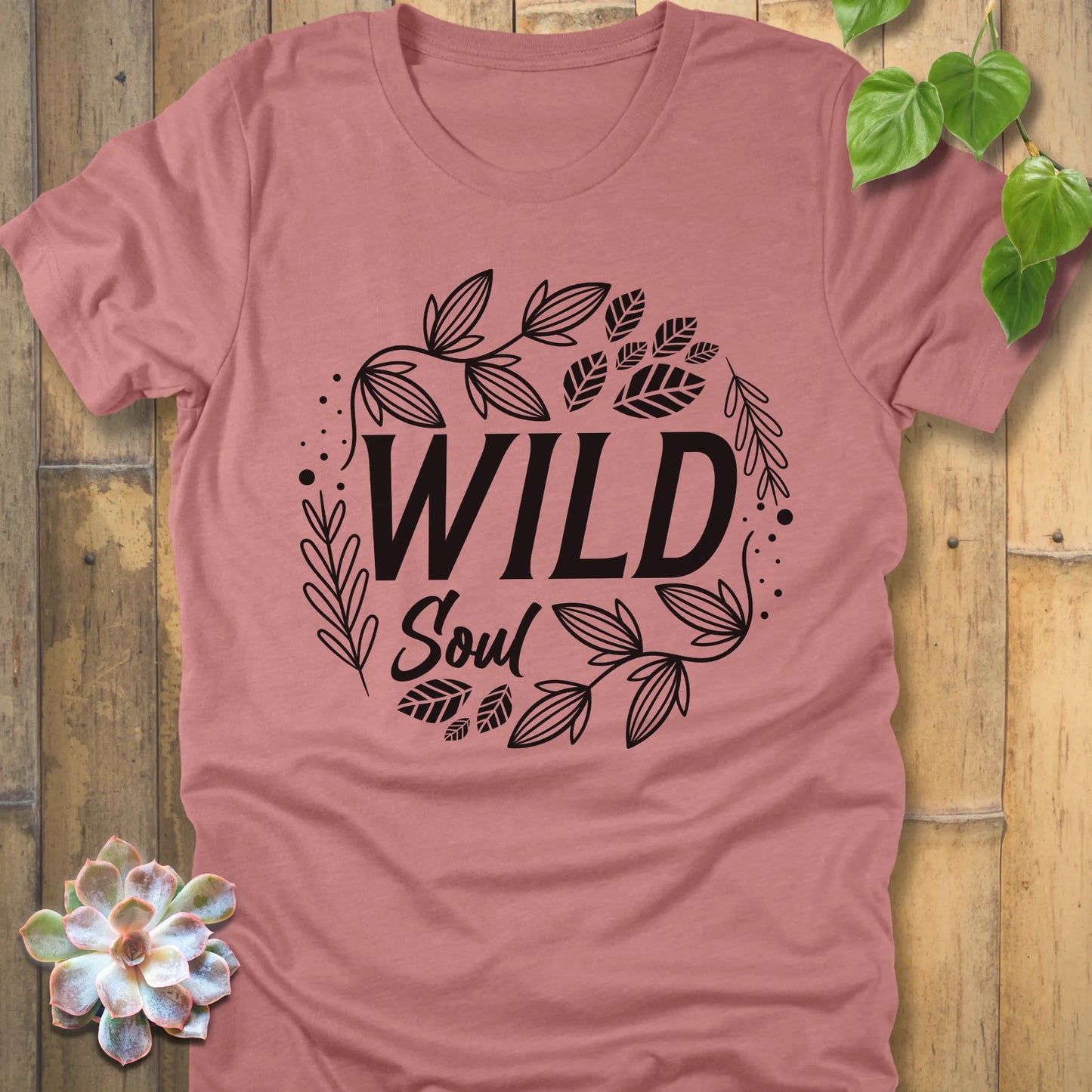 Heather Mauve t-shirt featuring the design Wild Soul printed in black letters with leaves