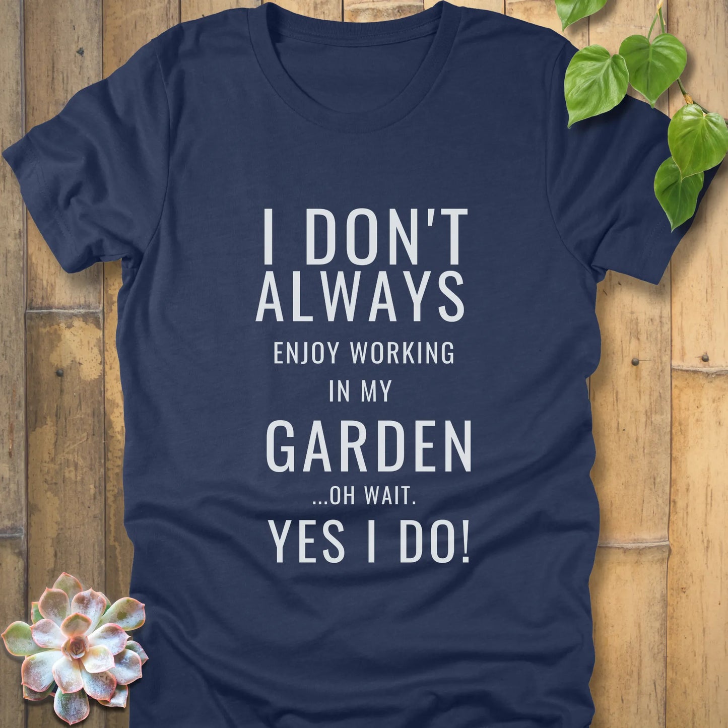 Heather Navy t-shirt featuring the design "I don't always enjoy working in my garden, oh wait yes I do" printed in bold white letters