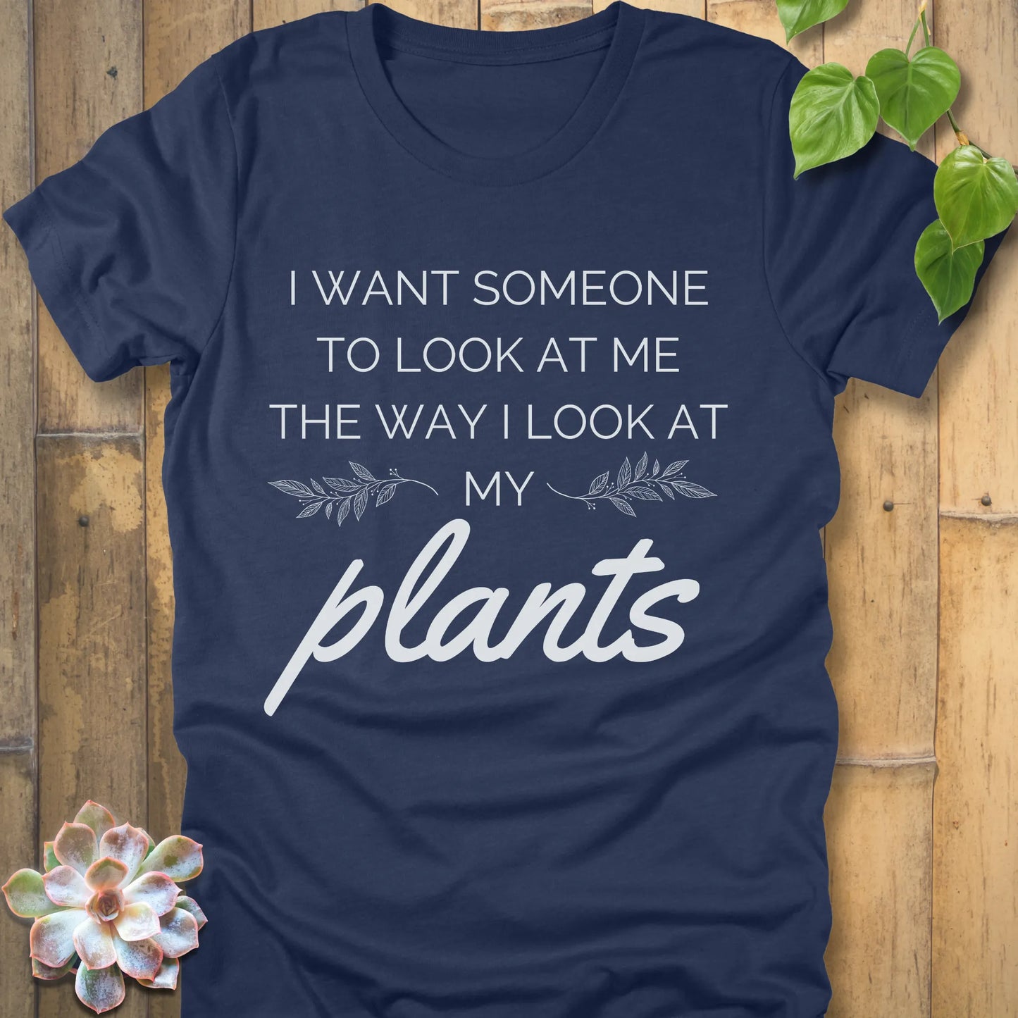 Heather Navy t-shirt with the phrase "I want someone to look at me the way I look at my plants" in bold grey lettering.