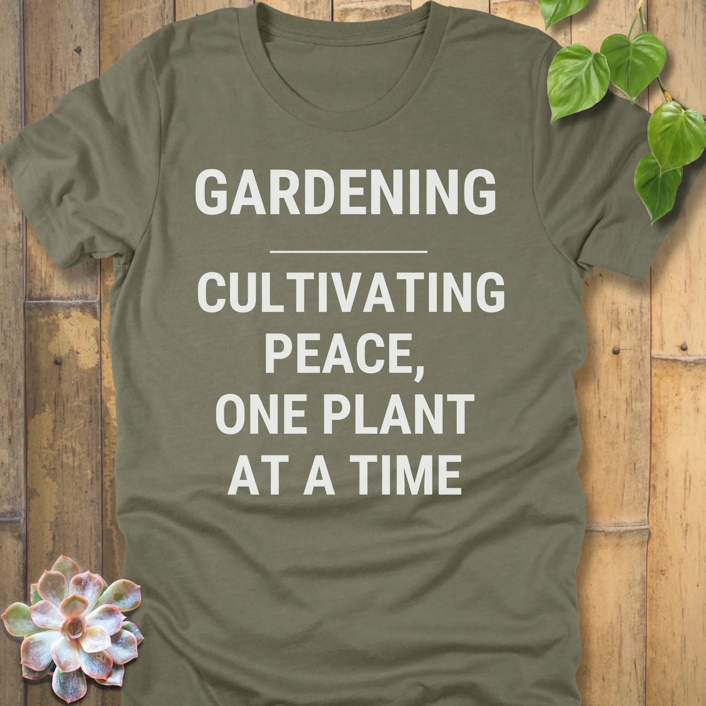 Heather Olive t-shirt featuring the design Gardening Cultivating Peace, One Plant At A Time printed in bold white letters, funny gardening shirt.