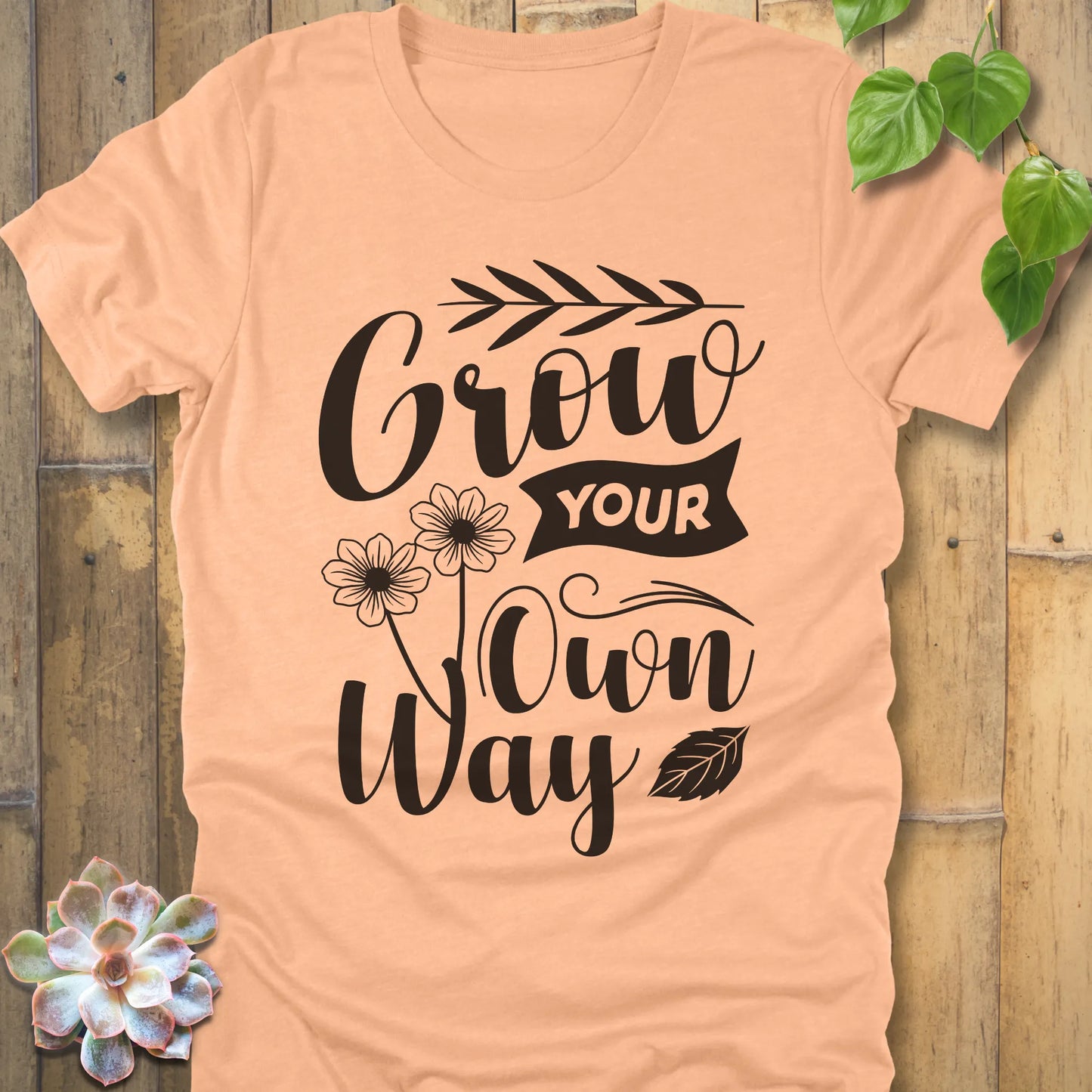 Heather Peach cotton graphic t-shirt featuring the inspirational phrase Grow your own way, stylish casual wear.