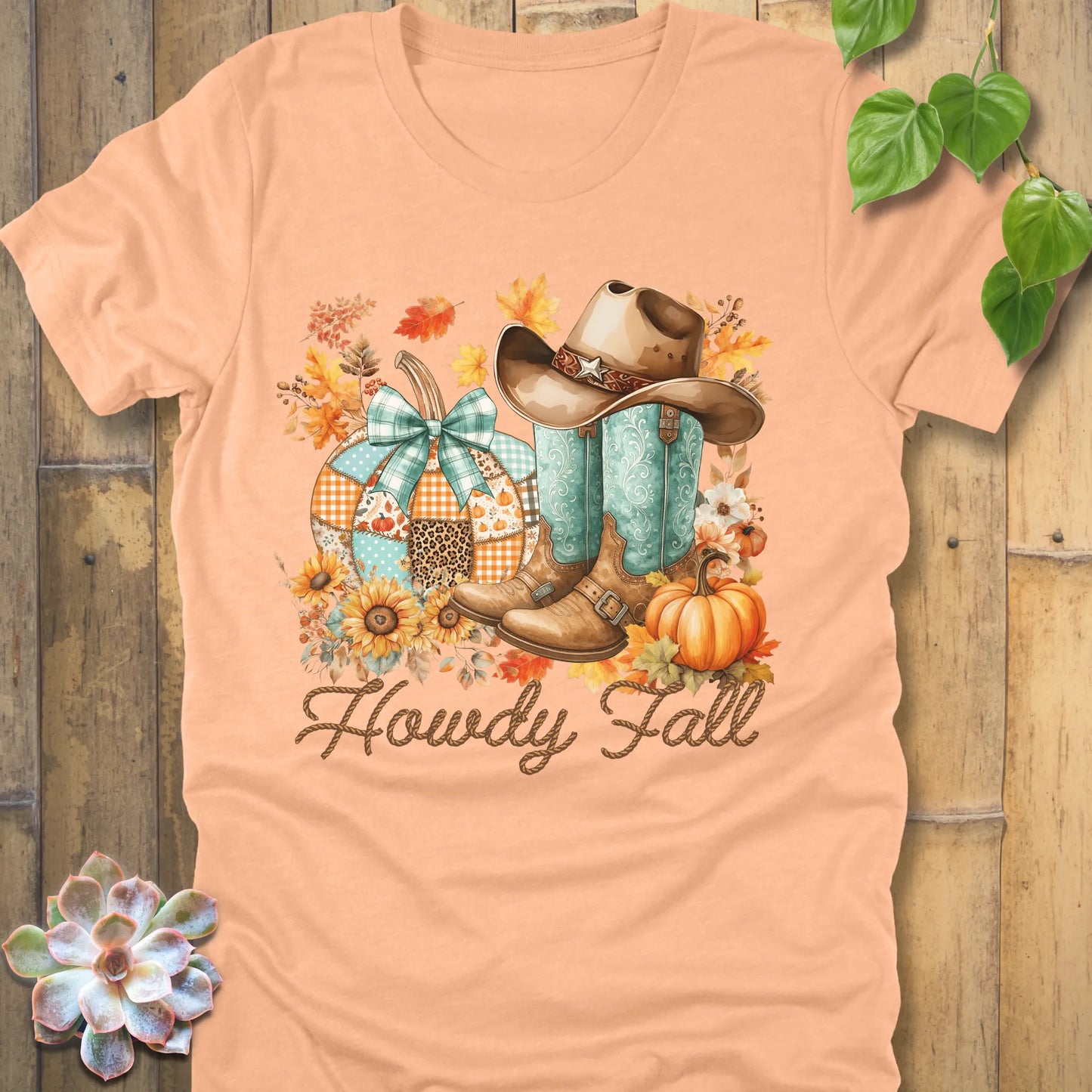 Heather Peach t-shirt featuring the design Howdy Fall with flowers, boots and hat