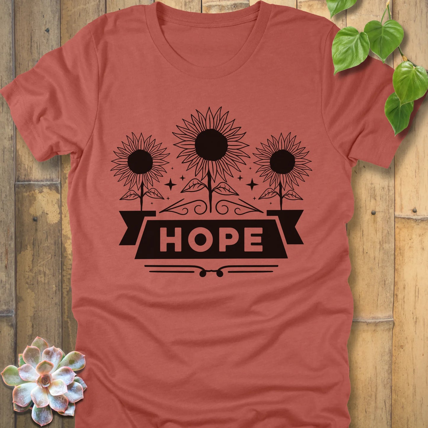 Heather clay t-shirt featuring the design Hope with bold letters and 3 sunflower print