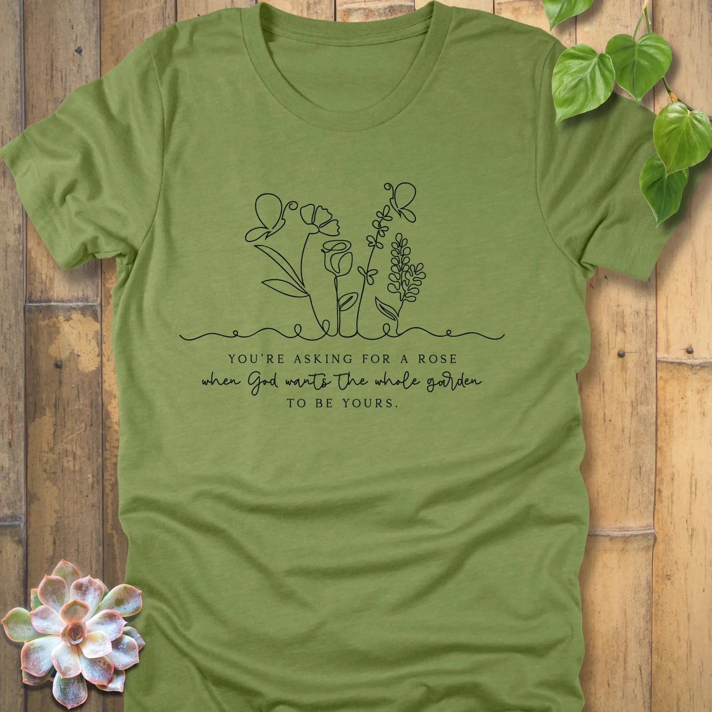 Heather green t-shirt featuring the design Asking for a rose, printed in black letters eco-friendly casual top