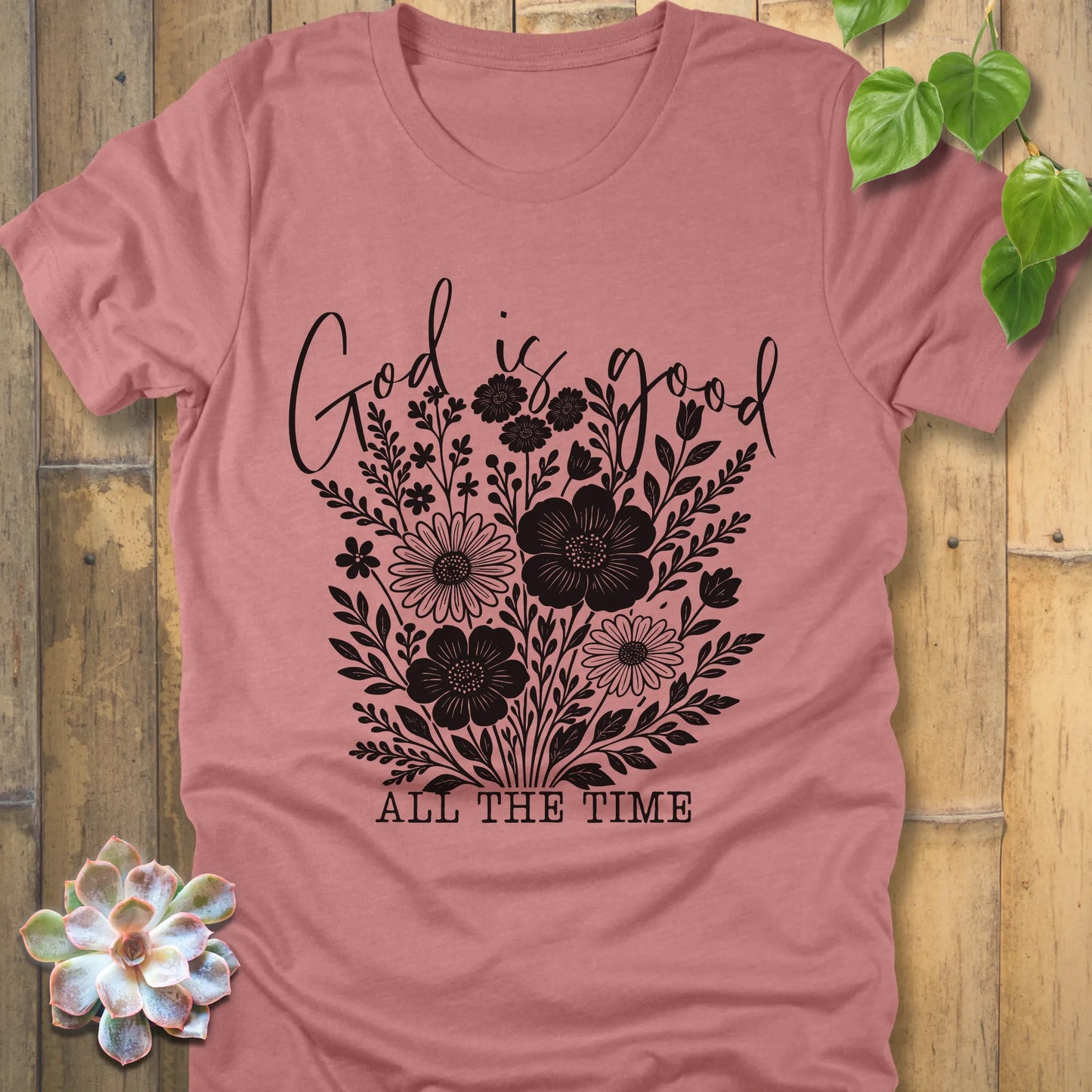 Heather mauve t-shirt featuring the design God is Good printed with flowers in a soft floral style