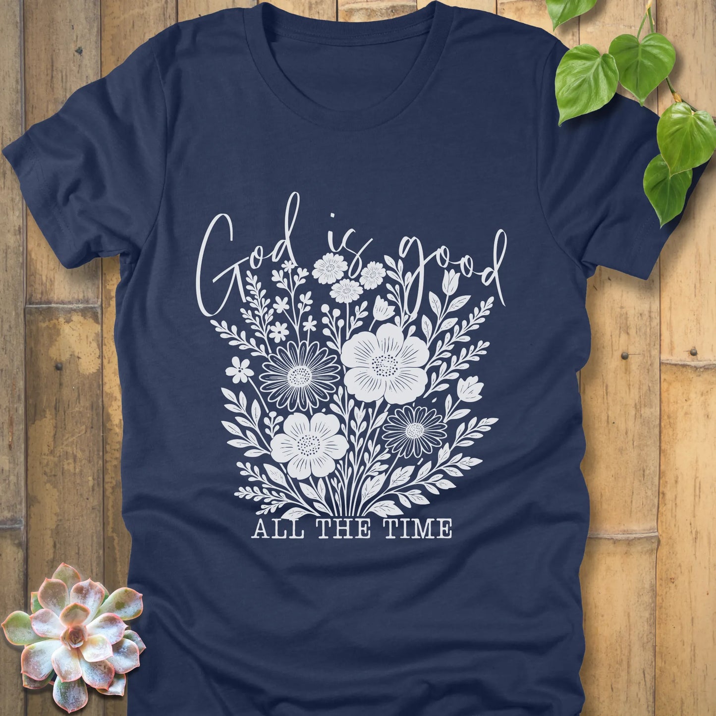 Heather navy t-shirt featuring the design God is Good printed with flowers in a soft floral style