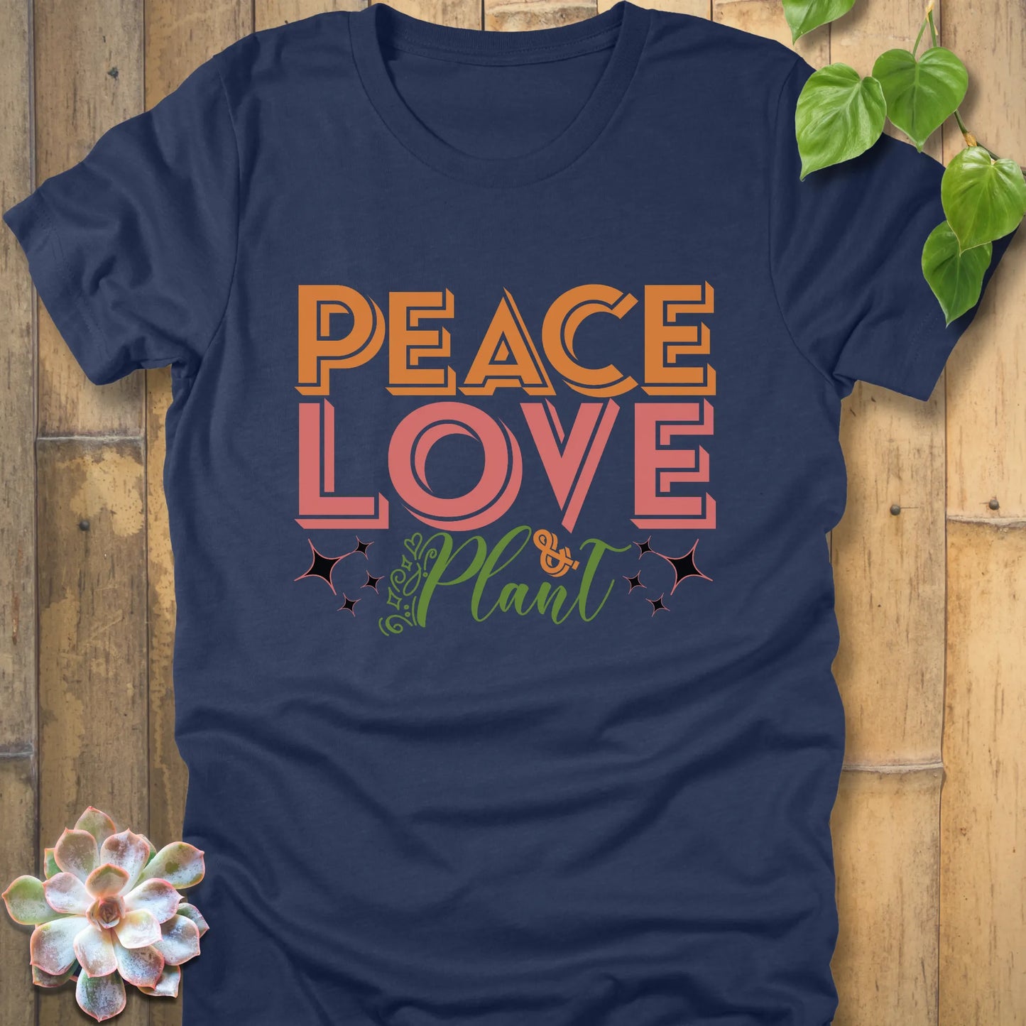 Heather navy t-shirt featuring the design Peace Love Plant printed in bold letters, sustainable cotton eco tee