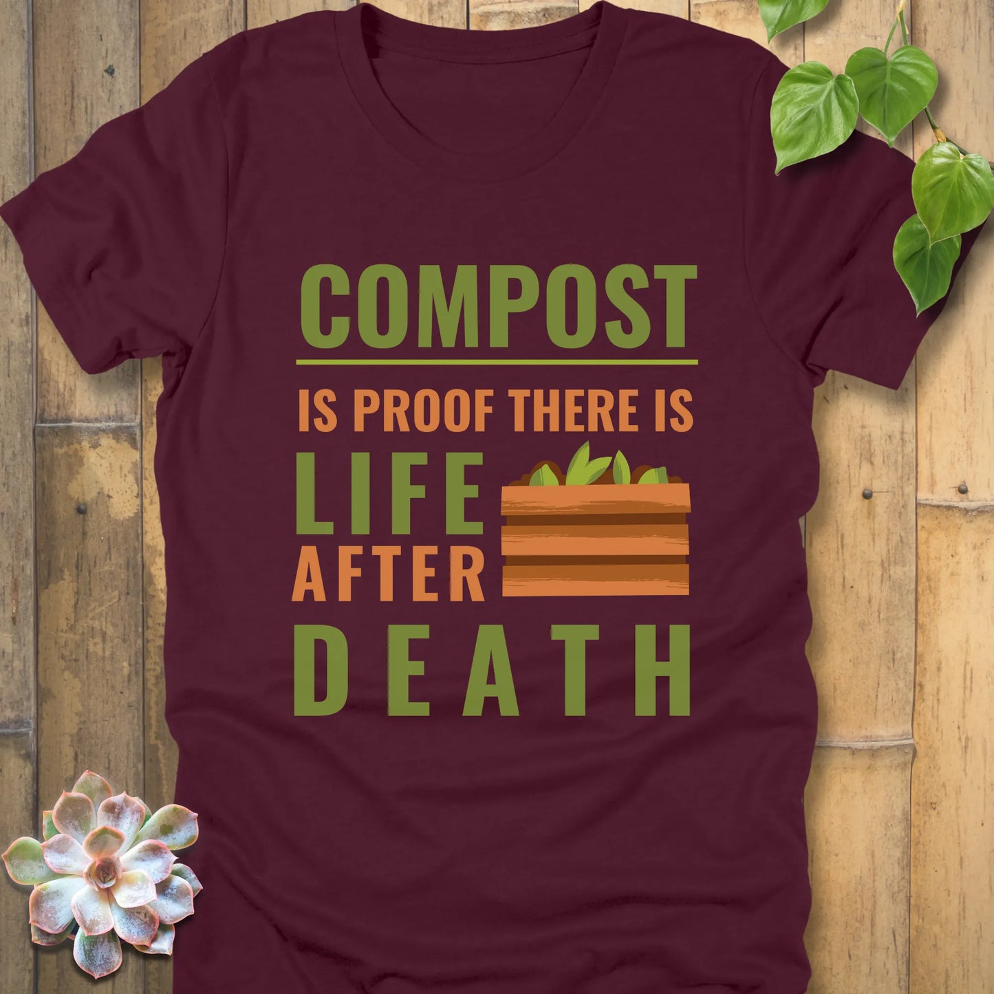 Maroon t-shirt featuring the design Compost is proof, there is life after death printed in bold letters