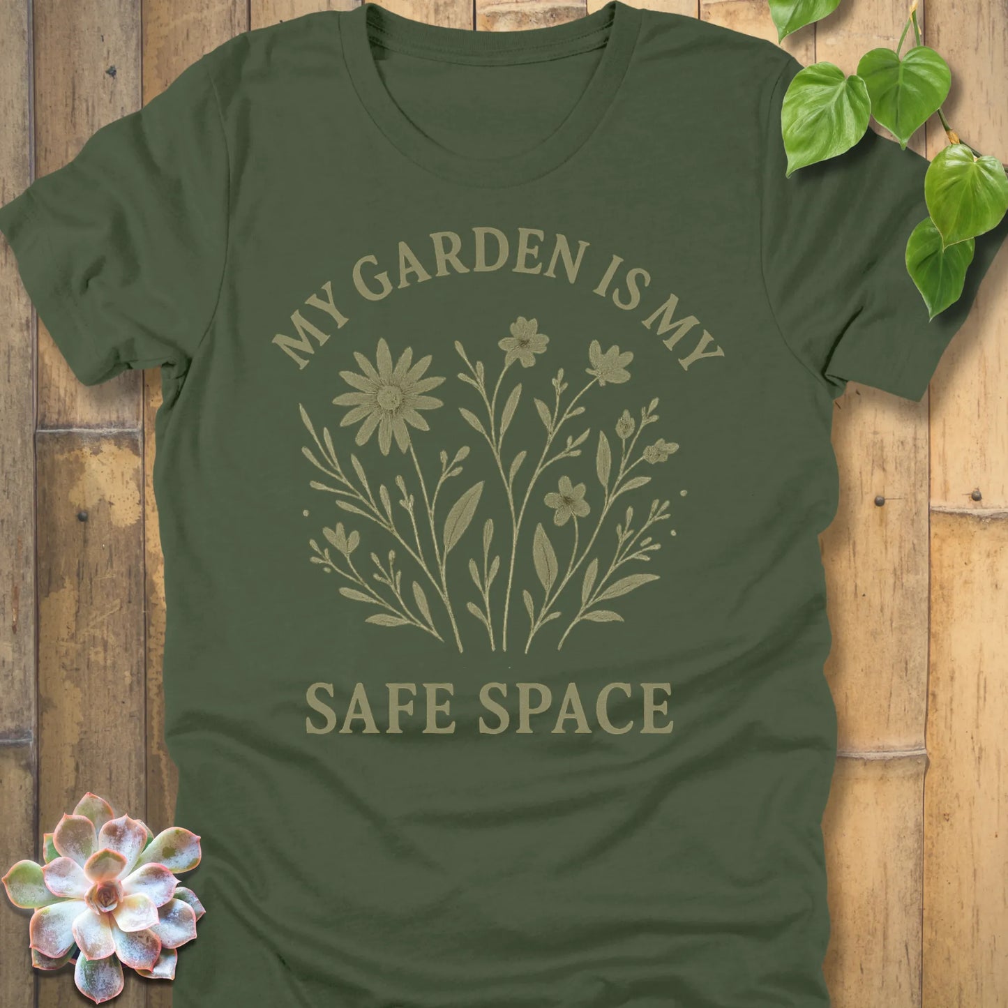 Military Green t-shirt featuring the design My Garden Is My Safe Place printed in bold letters, gardening shirt for plant lovers.