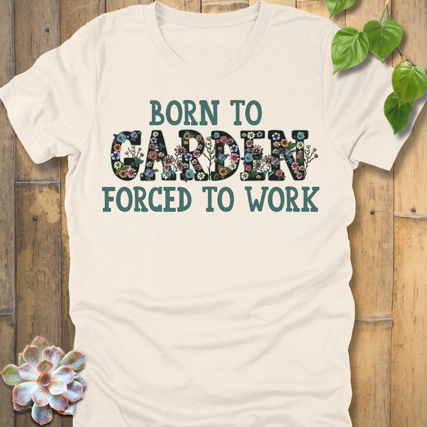 Natural t-shirt featuring the design Born To Garden printed in bold letters, gardening lover shirt