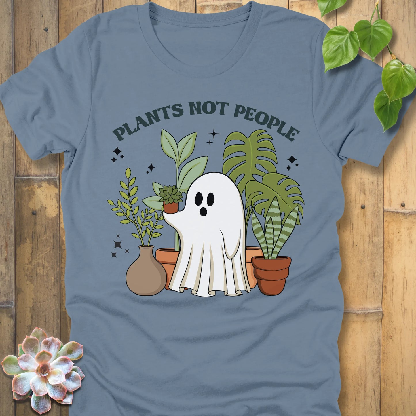 Steel Blue t-shirt featuring the design Plants Not People printed in bold letters with halloween design a ghost holding plants