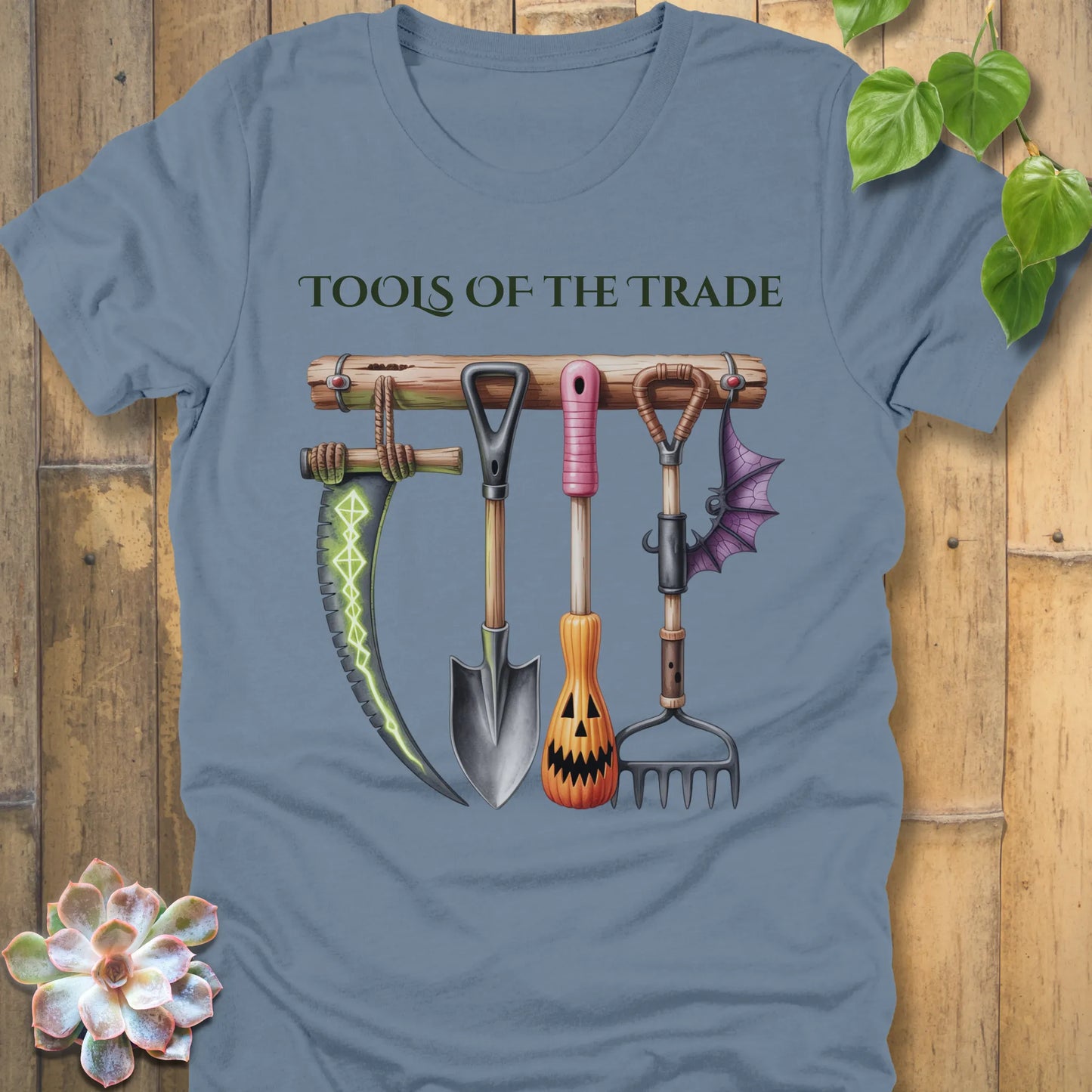 Steel Blue t-shirt featuring the design Tools of the Trade printed in bold letters with a halloween tools