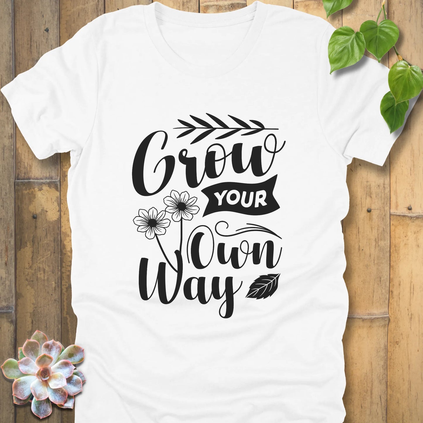 White graphic t-shirt featuring the inspirational design Grow your own way, made from soft cotton casual wear.