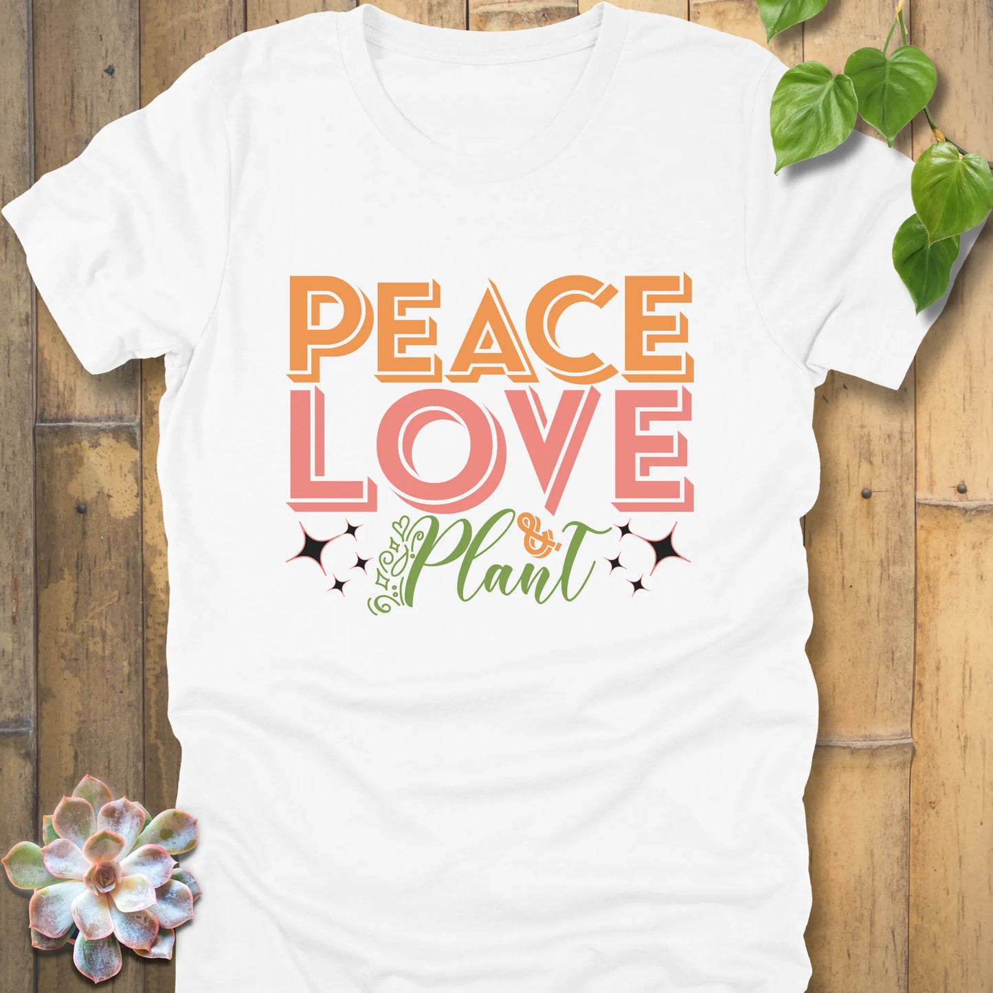 White t-shirt featuring the design Peace Love Plant printed in bold letters, eco-friendly plant lover shirt