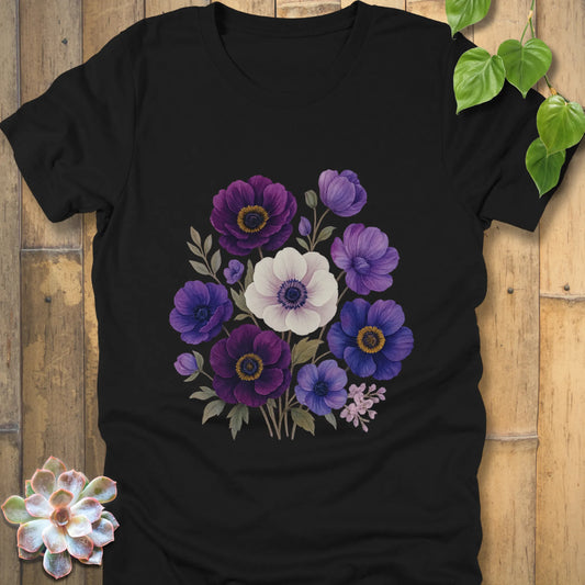 Black t-shirt with a detailed floral design showing a bouquet of purple, violet, blue, and white blossoms with green stems and leaves.