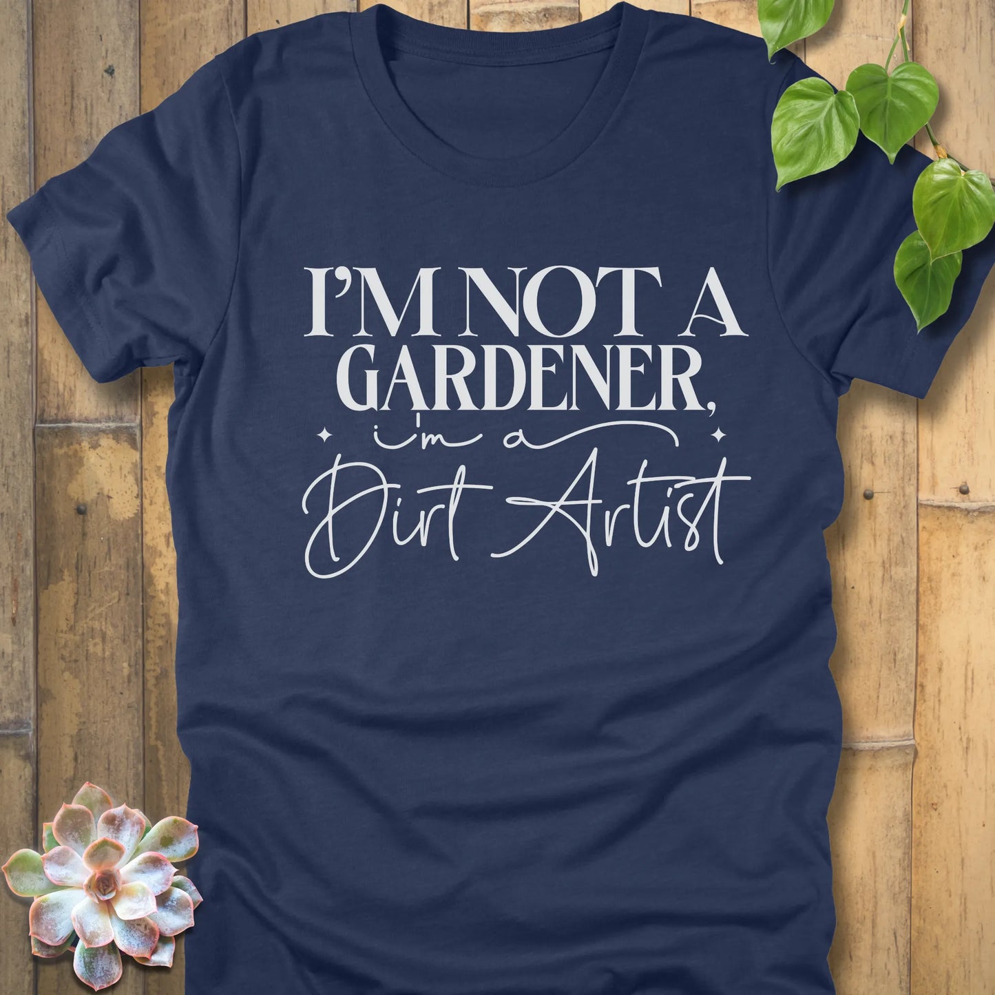 Heather Green Bella Canvas 3001 unisex t-shirt with white print: ‘I’m not a gardener, I’m a dirt artist