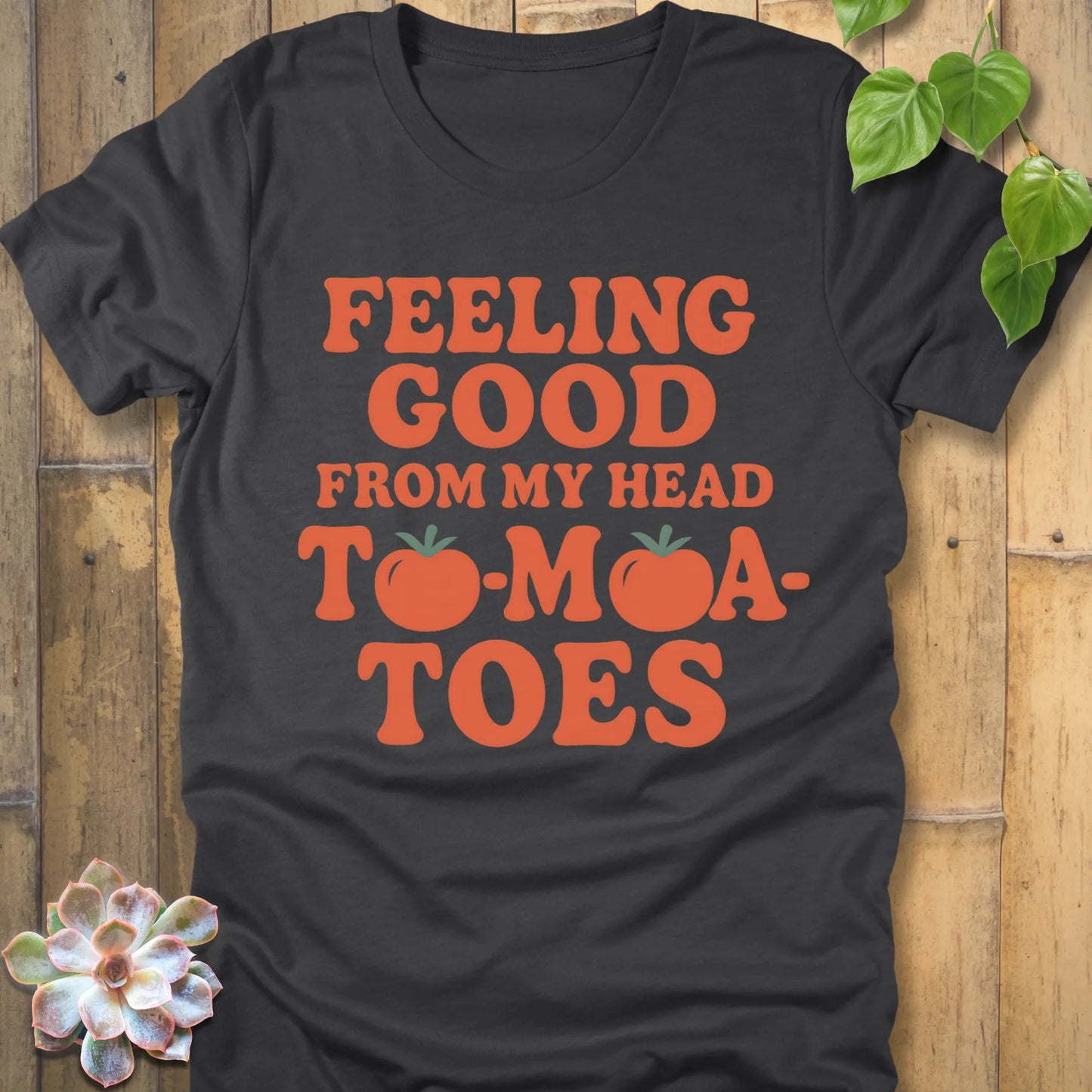 Dark Heather Grey  t-shirt featuring the design "Feeling Good from my head to-mat-toes" printed in bold orange letters