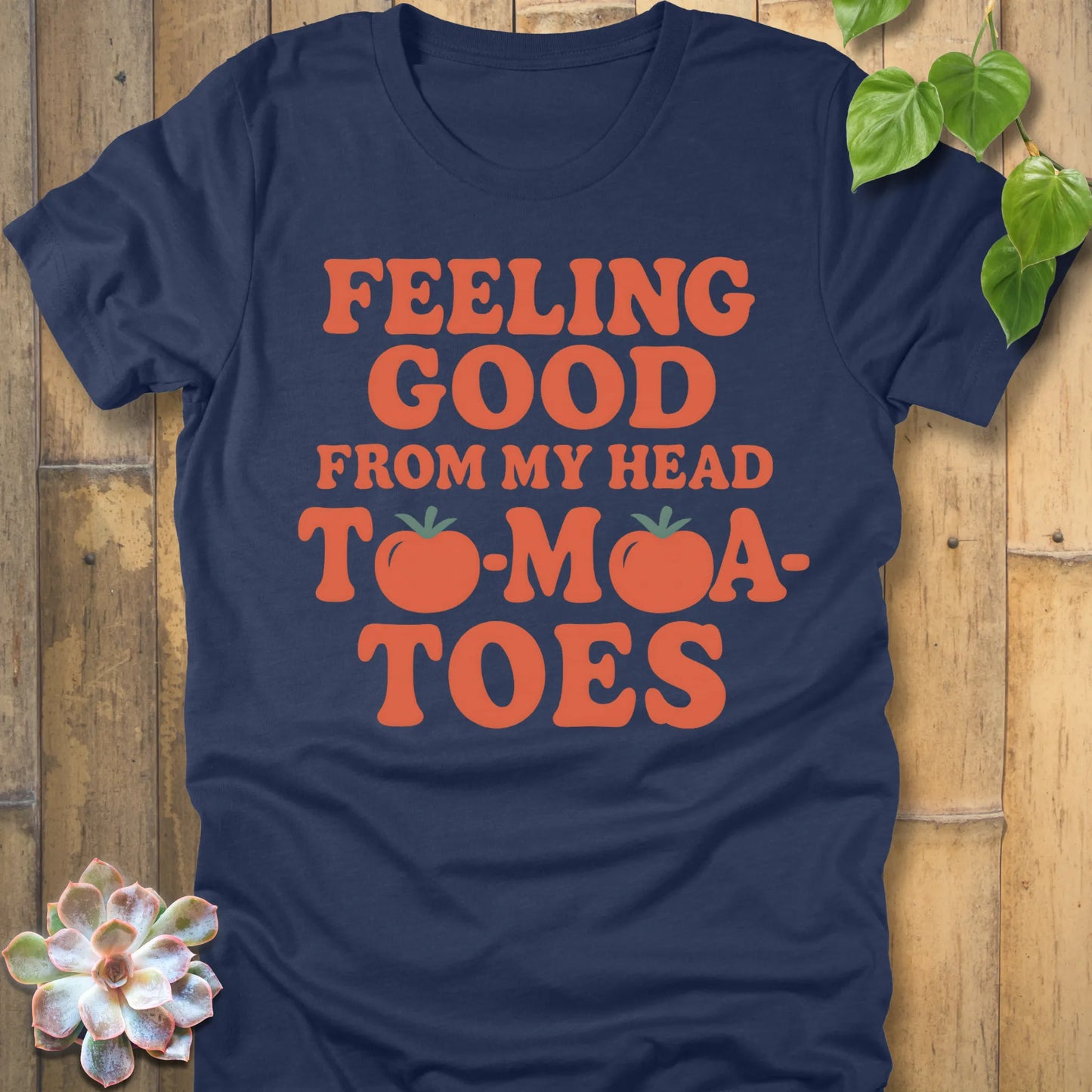 Heather Navy  t-shirt featuring the design "Feeling Good from my head to-mat-toes" printed in bold orange letters