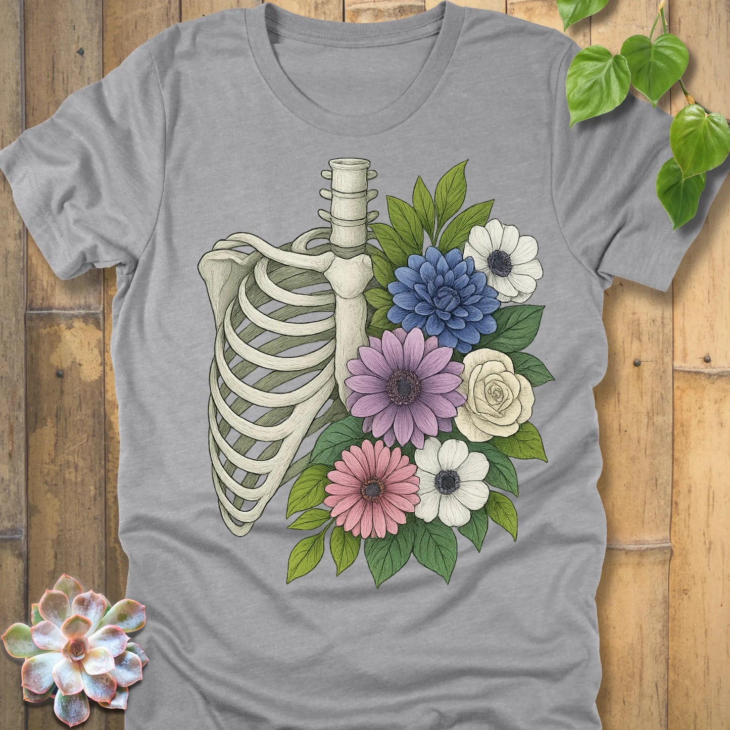 Floral Bones T-shirt in Athletic Heather  – skeleton ribcage with flowers graphic, premium quality Bella+Canvas tee.