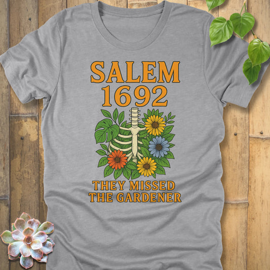 Athletic Heather – Salem 1692 They Missed the Gardener T-shirt in Athletic Heather, skeleton ribcage with flowers, Bella+Canvas 3001.